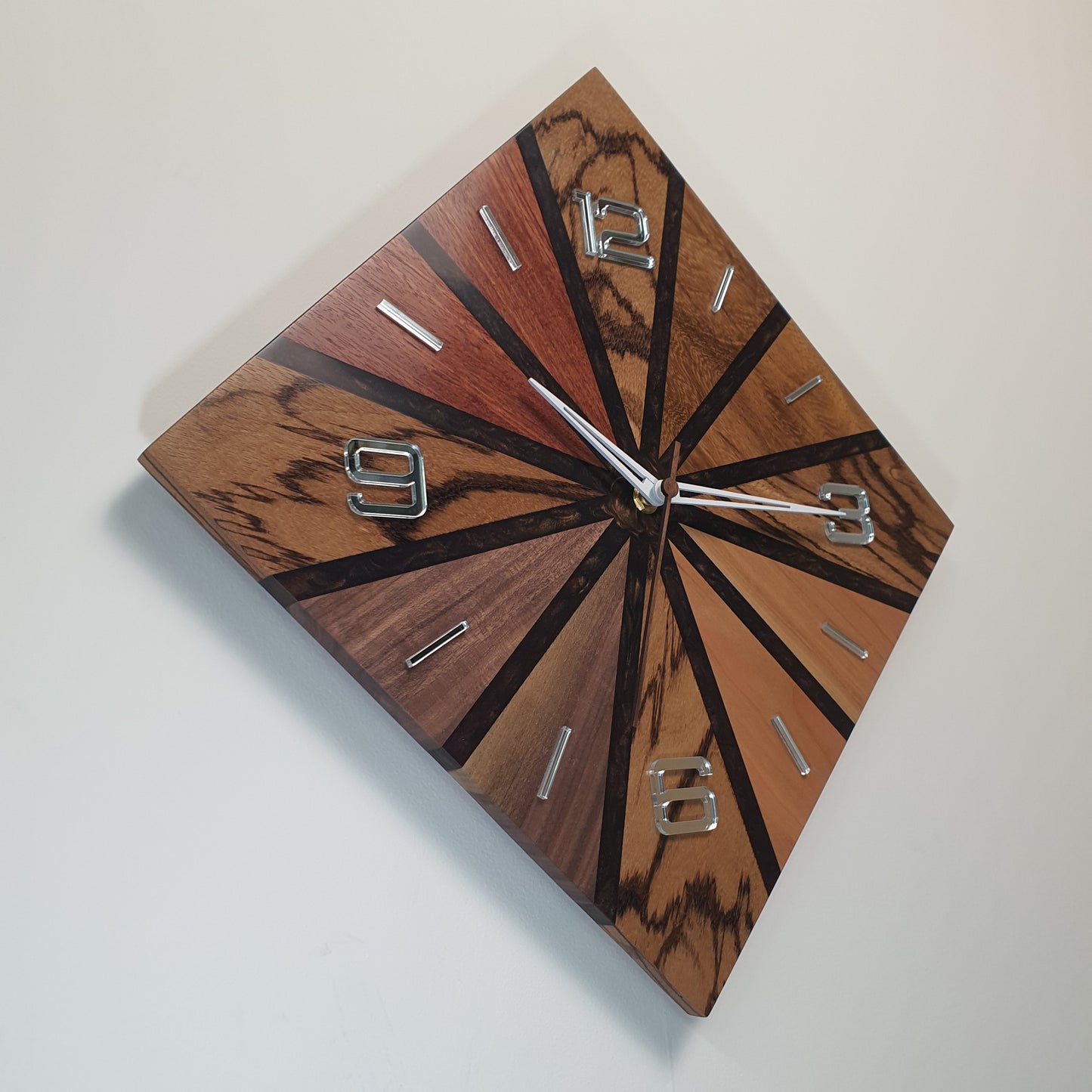 Right side view showing the white-painted wooden clock hands and number