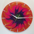 Front view of the “Neon Spiral” resin wall clock showing its vivid spiral pattern and glossy finish