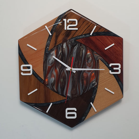 Front view of the “Fusion Hexa” wall clock showing its hexagonal shape and wooden segments combined with resin