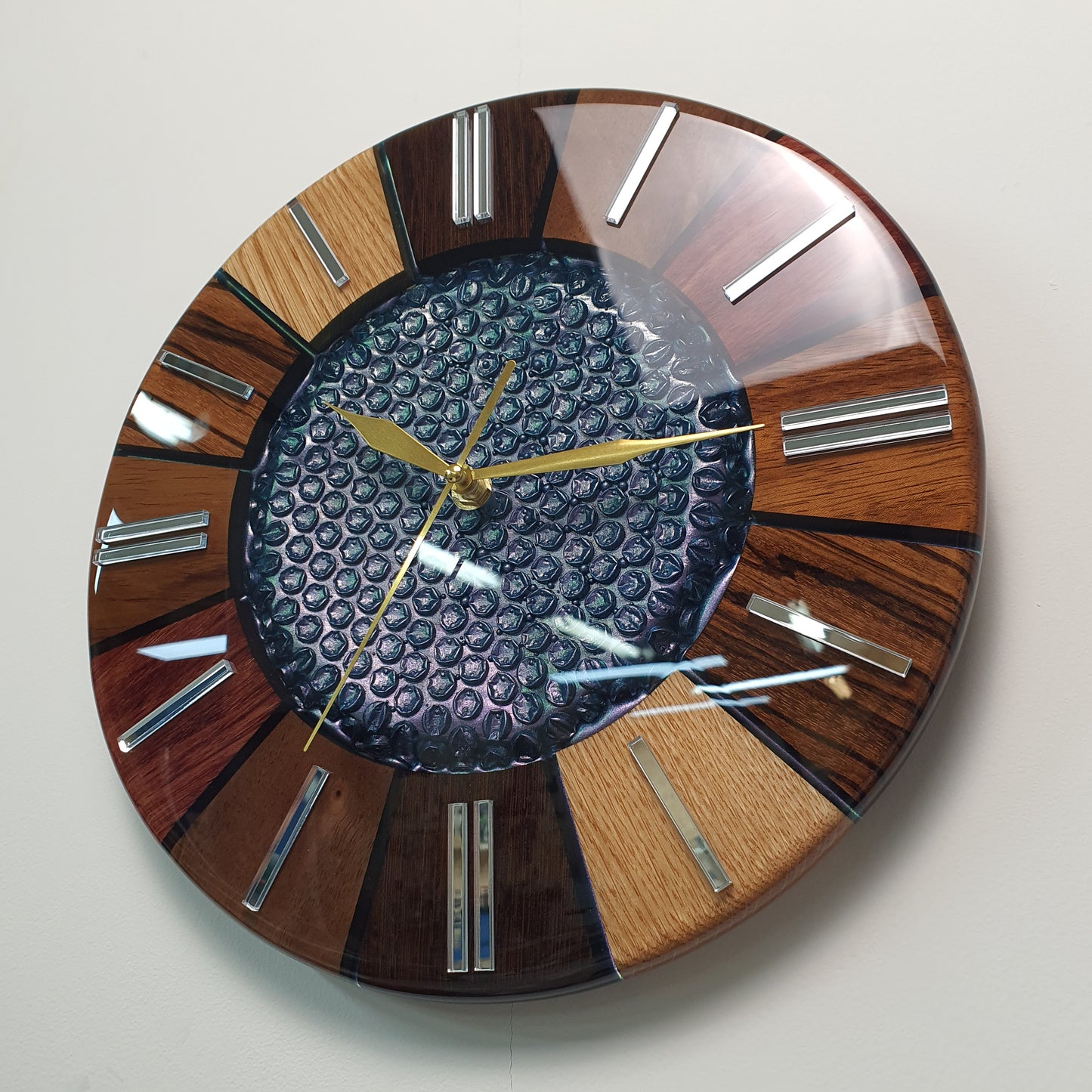 Angled side view capturing the curvature of the resin surface and color reflections