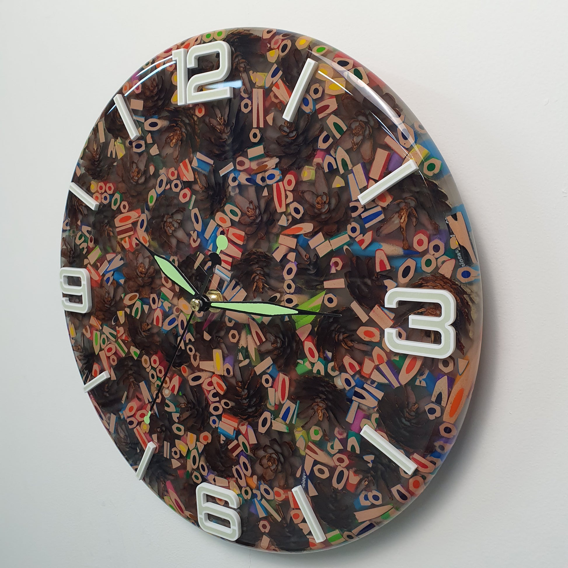 Macro detail of the resin surface revealing vivid colors, pinecone texture, and the depth of the epoxy finish.