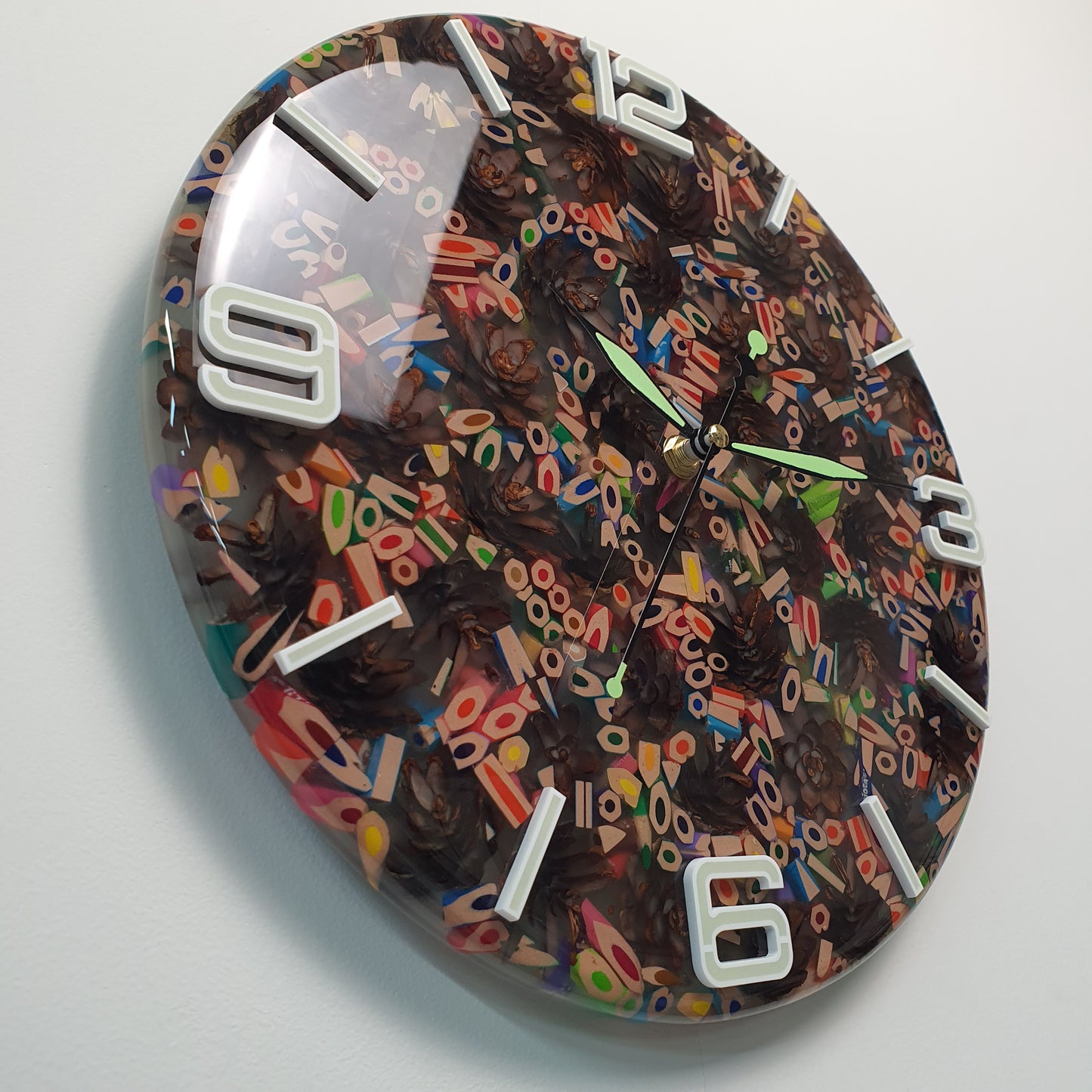 Angled side view of the “Pine & Color Fusion” clock highlighting the resin depth, glowing numbers, and handmade construction.