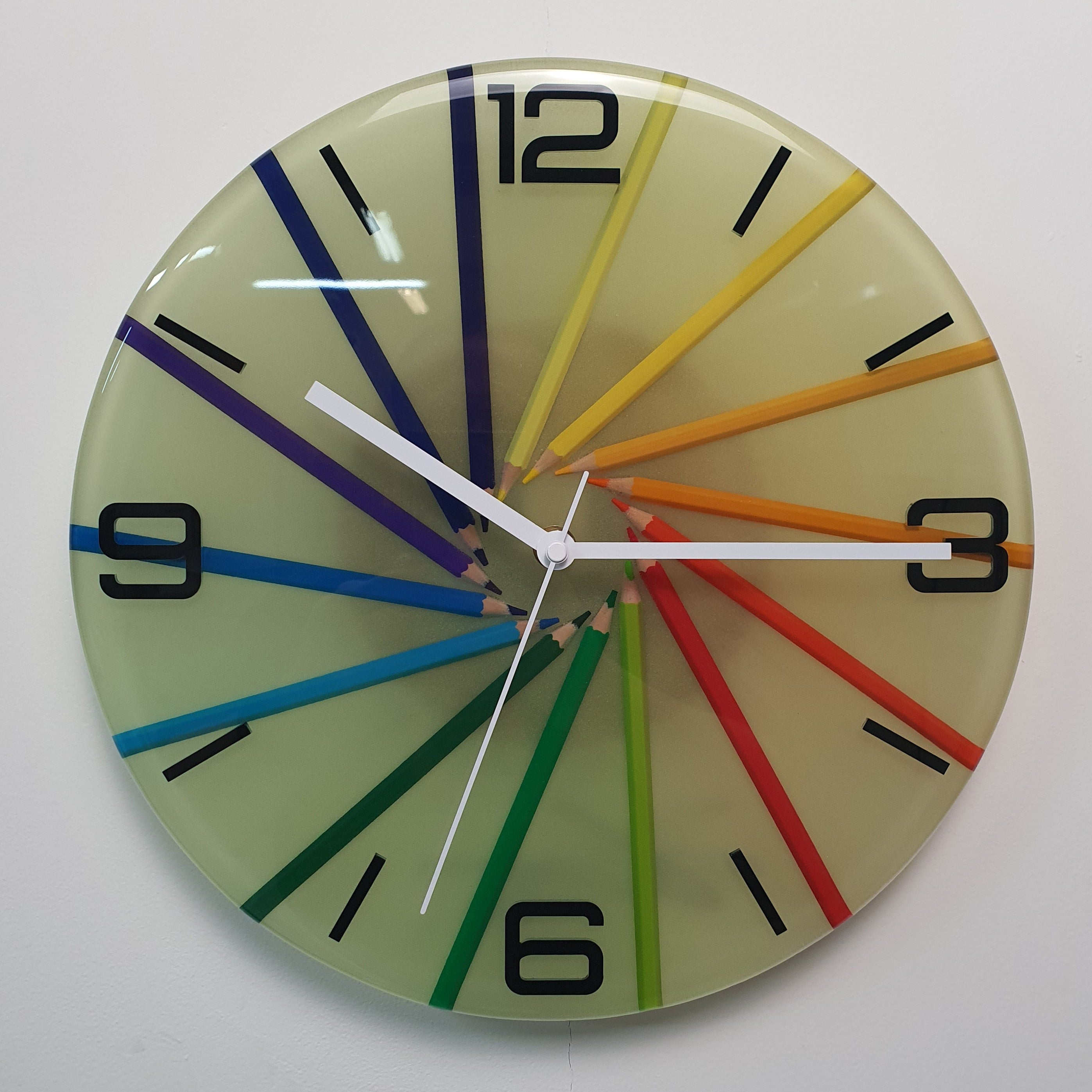 Front view of Studio Colors Neon Spiral epoxy resin wall clock with coloured pencil spiral composition
