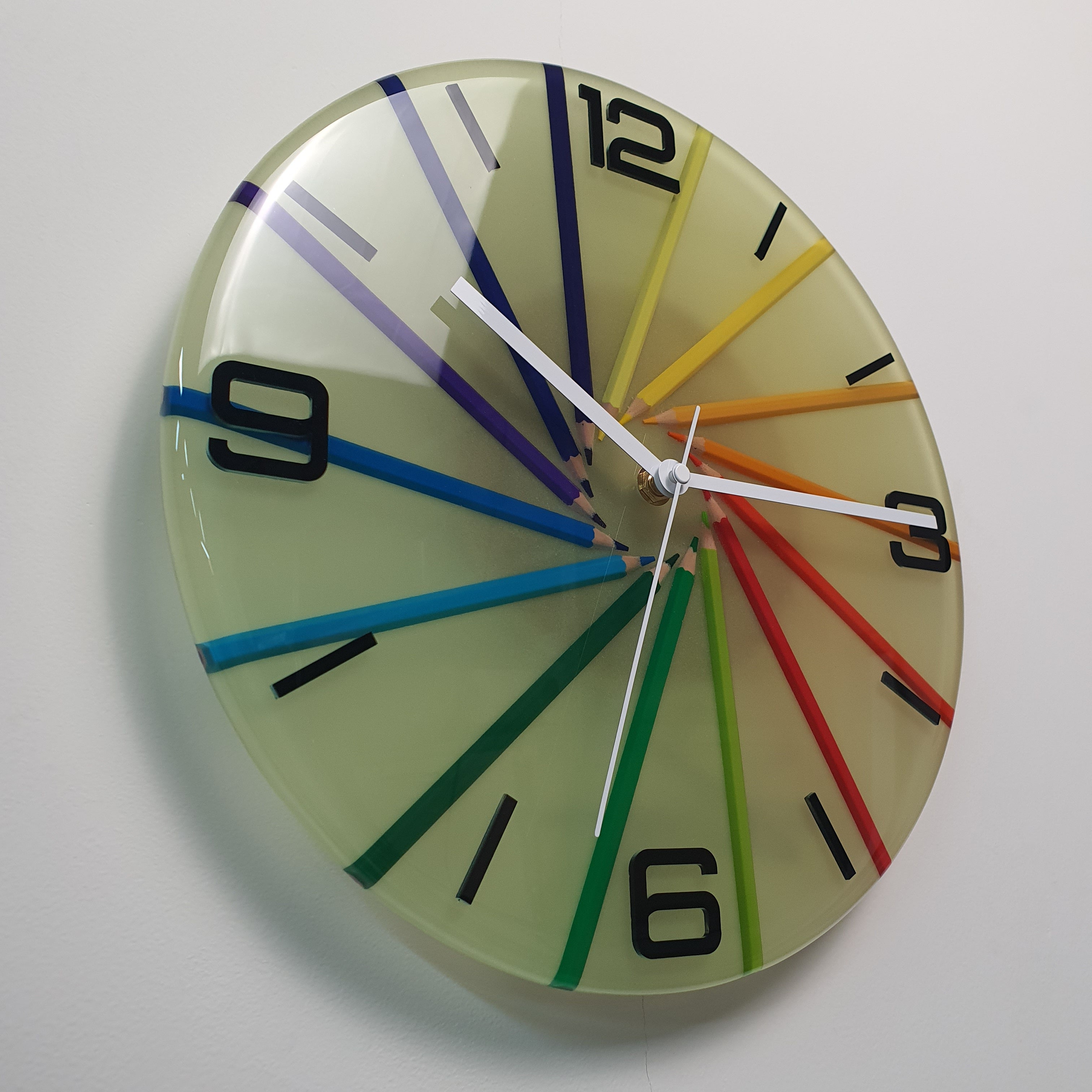 Side angle view of Studio Colors Neon Spiral resin wall clock