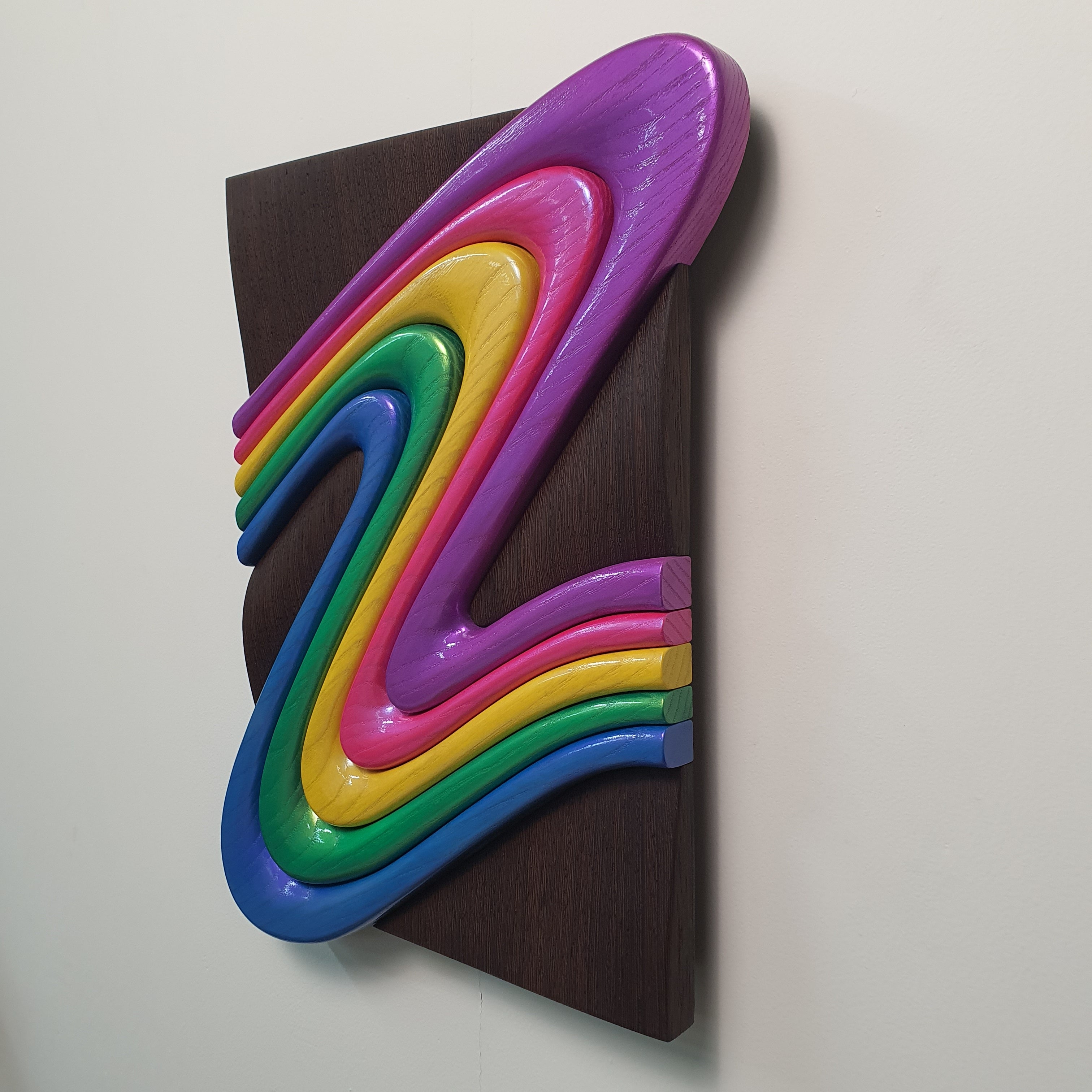 Z Frozen Motion wood relief angled perspective showing depth and layered curves