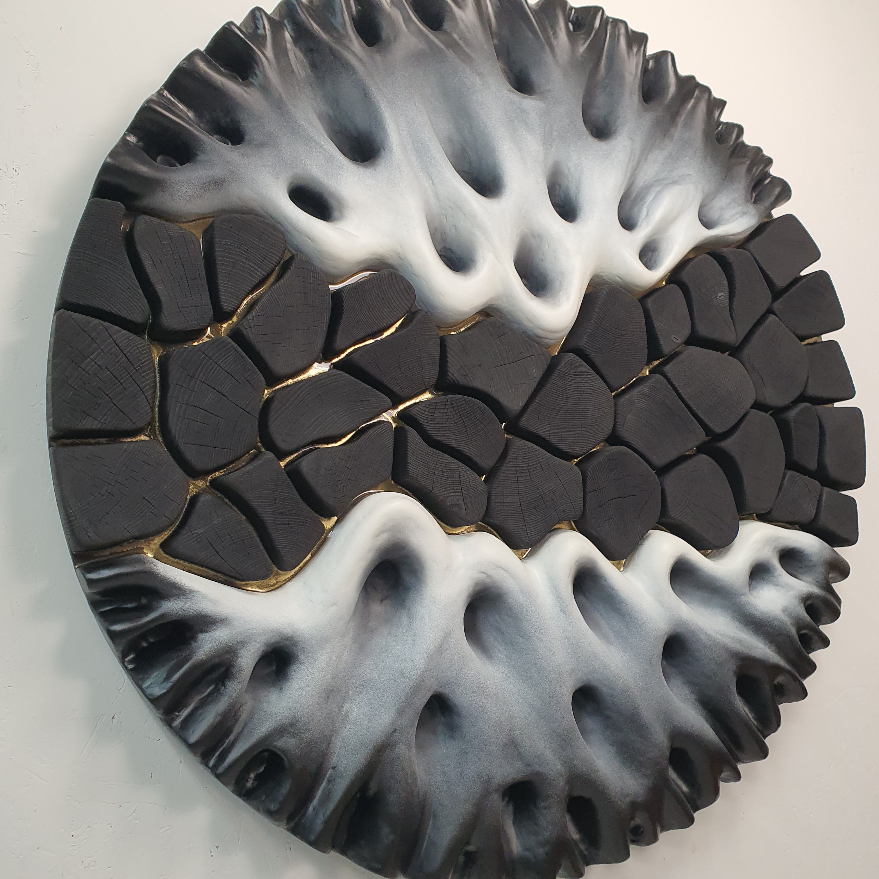 Side angle of 3D wall sculpture showing layered structure and thickness