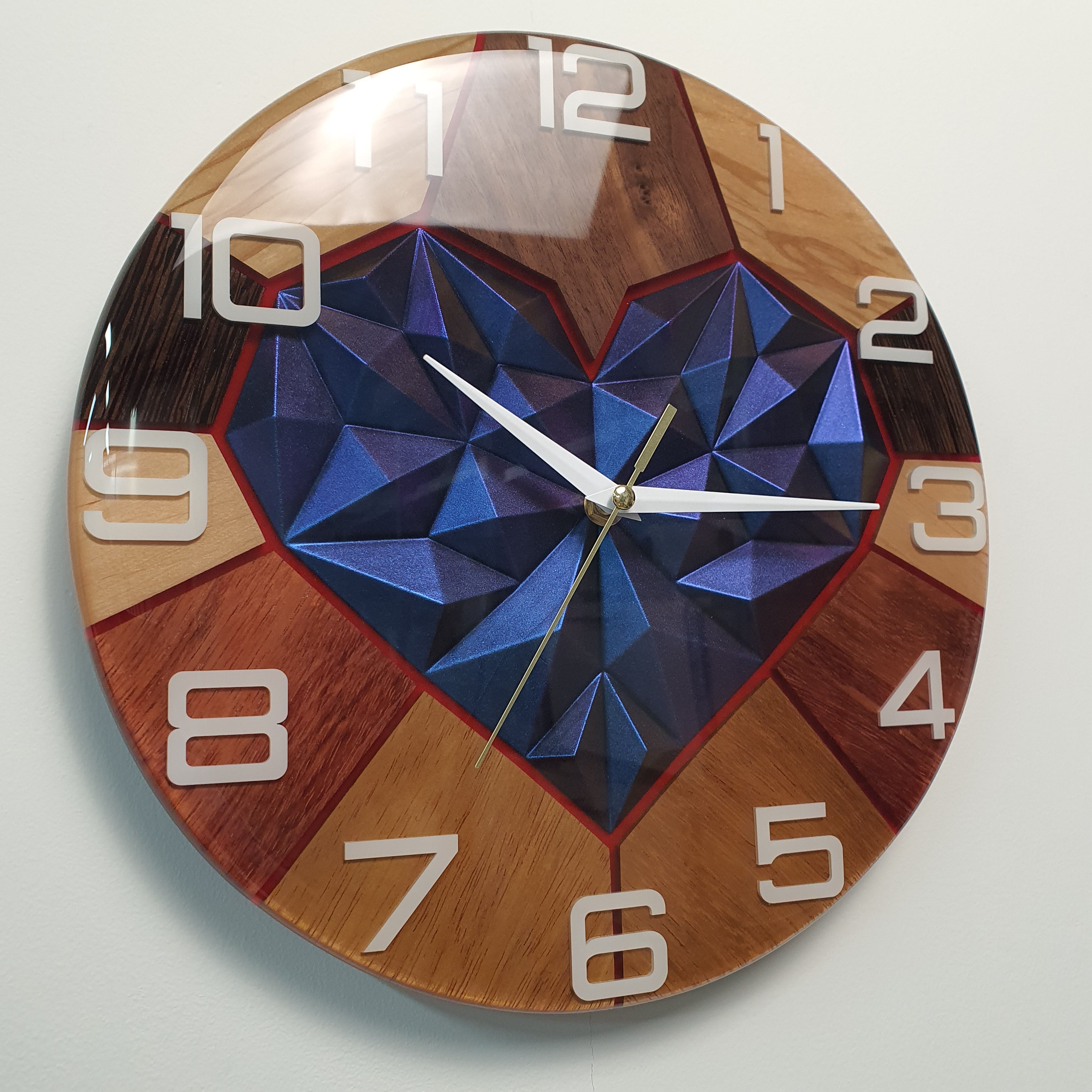 White plexiglass numbers cast into resin with shifting chameleon color reflections