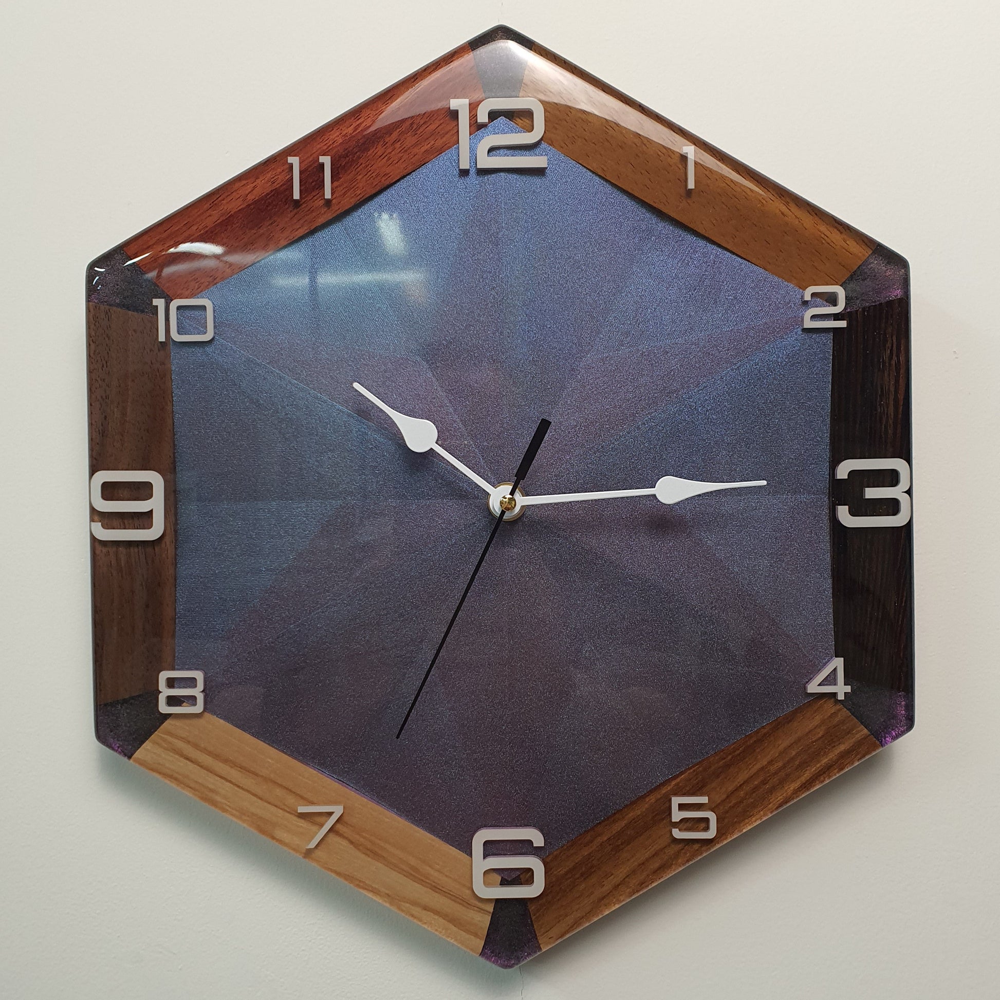 modern geometric wall clock with chameleon effect front view