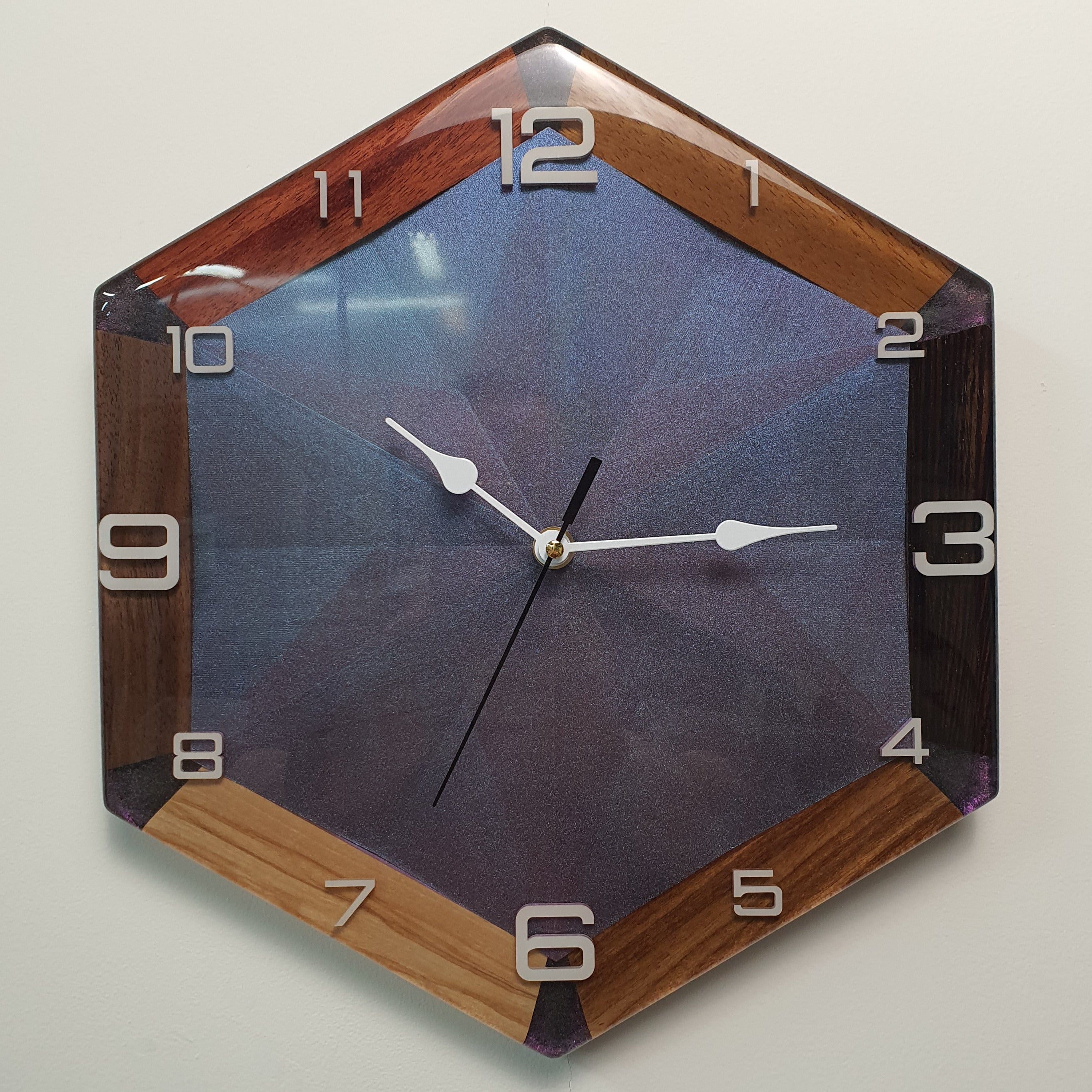 modern geometric wall clock with chameleon effect front view