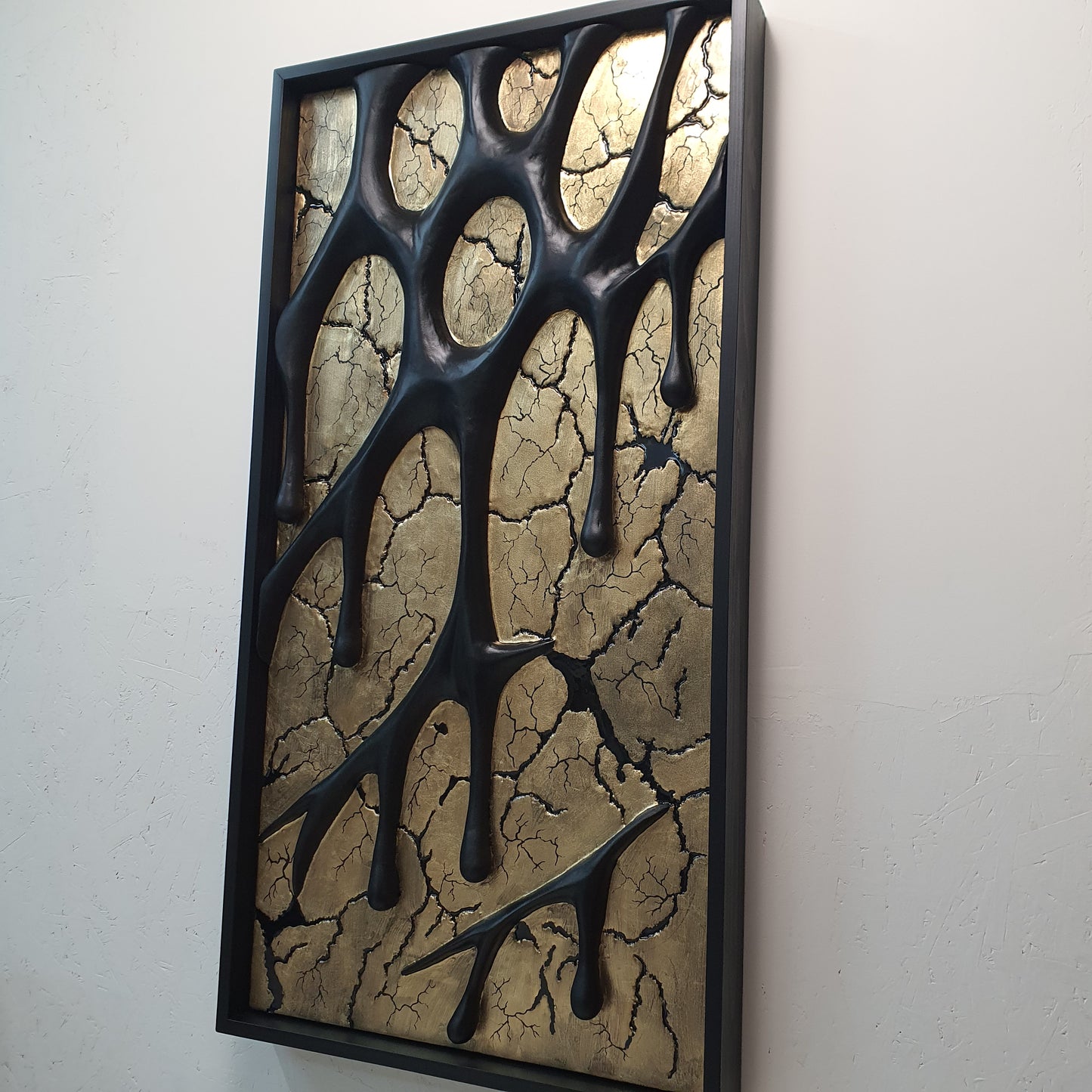 right side detail showing depth and layered black resin forms