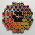 Spectrum Hive wooden wall clock with rainbow resin details and mirrored plexiglass markers front view