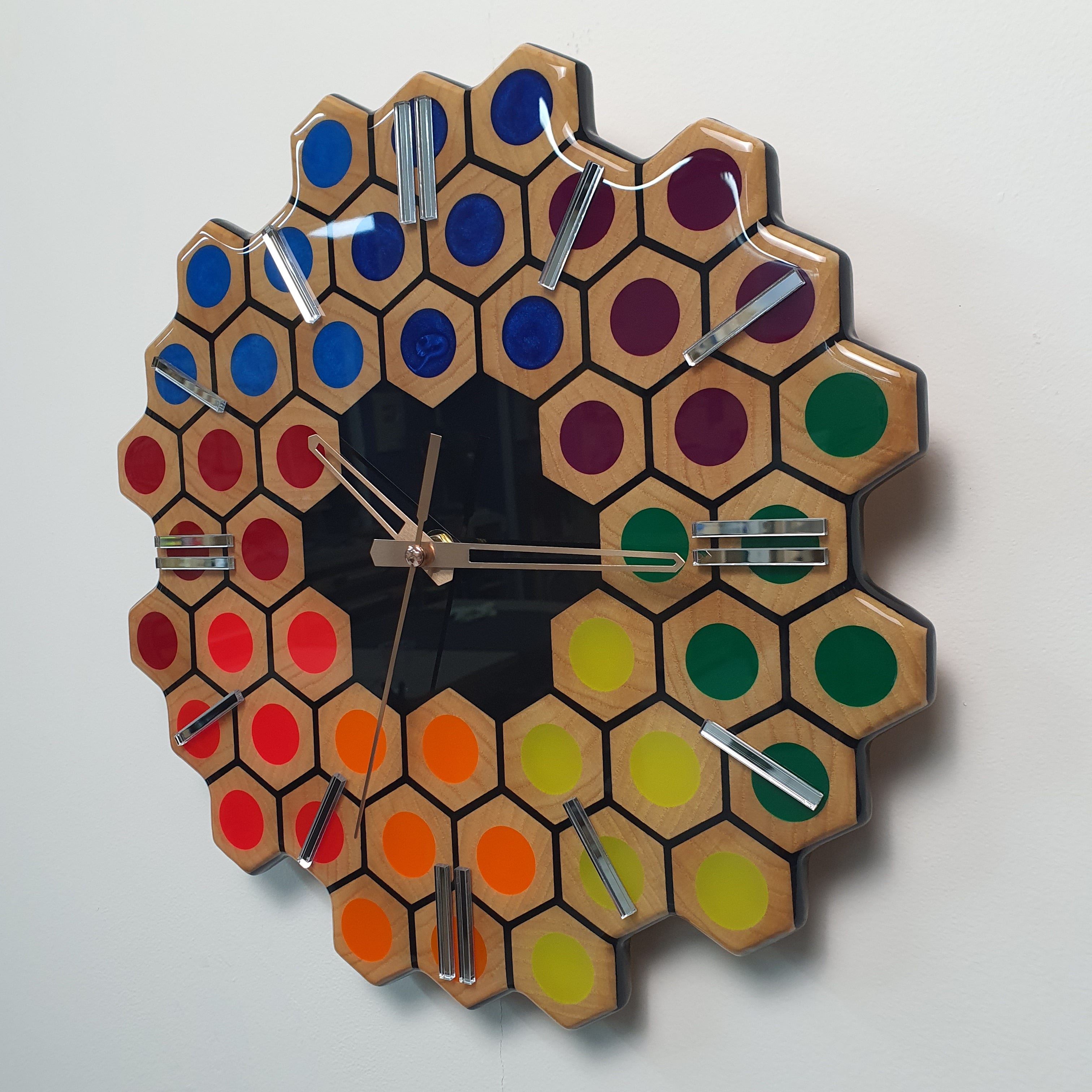 Modern handmade epoxy resin clock with hexagonal rainbow composition and black center