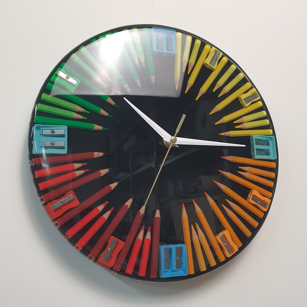 Side angle of handcrafted epoxy resin clock with colorful pencil elements