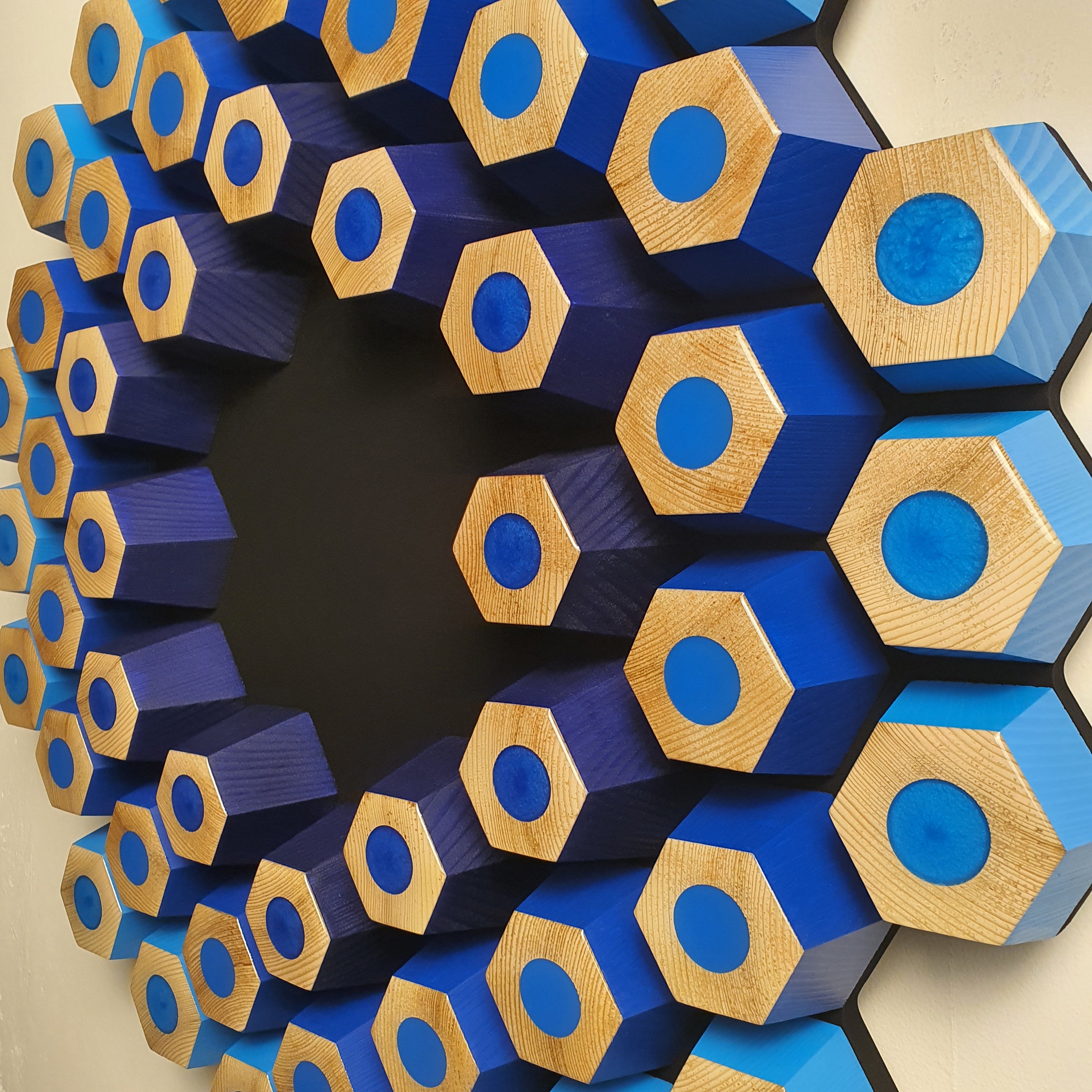 Handmade 3D wooden wall art with hexagonal structure, glossy resin details and deep black center