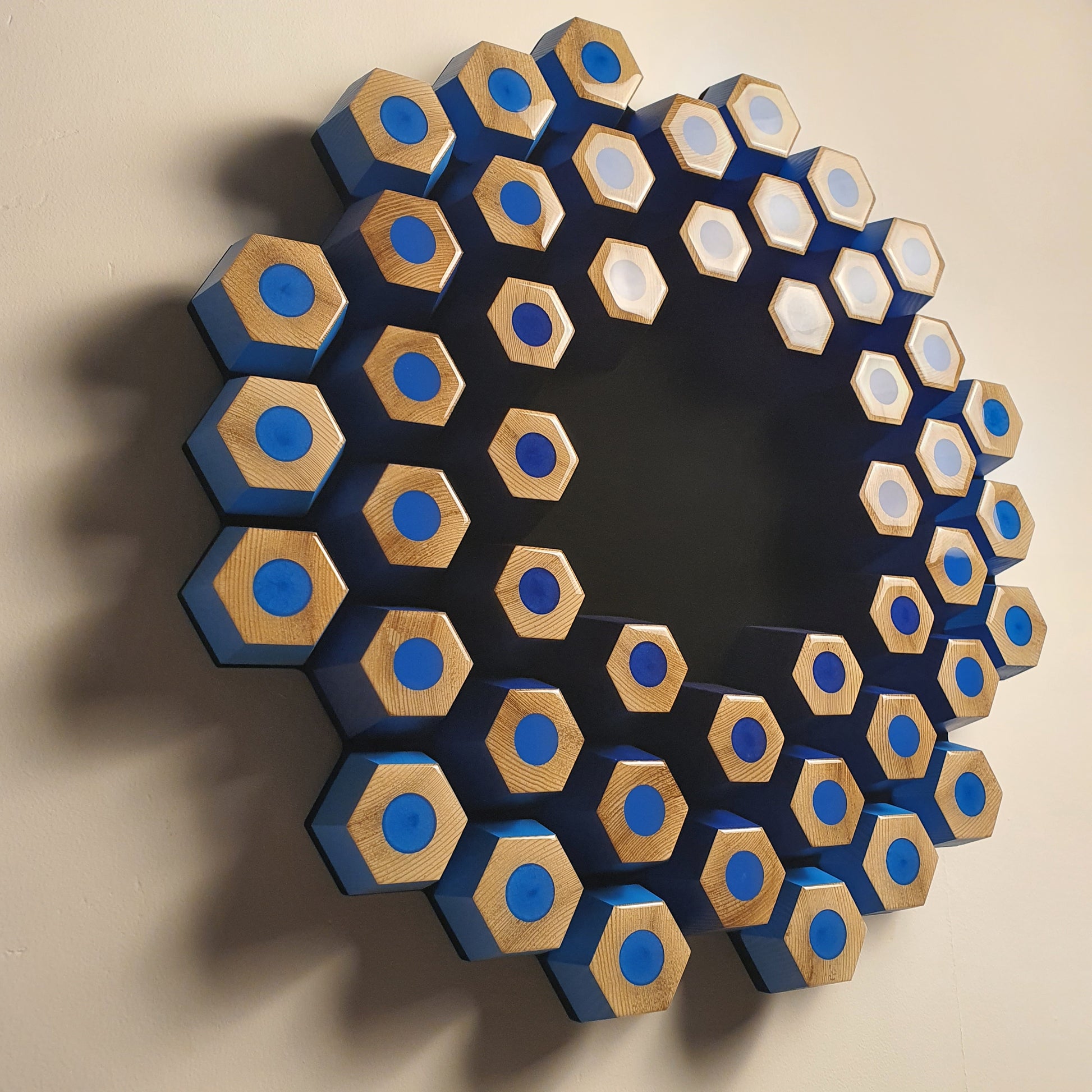 Abstract modular wall sculpture from the Profondità series with blue tones and spatial depth