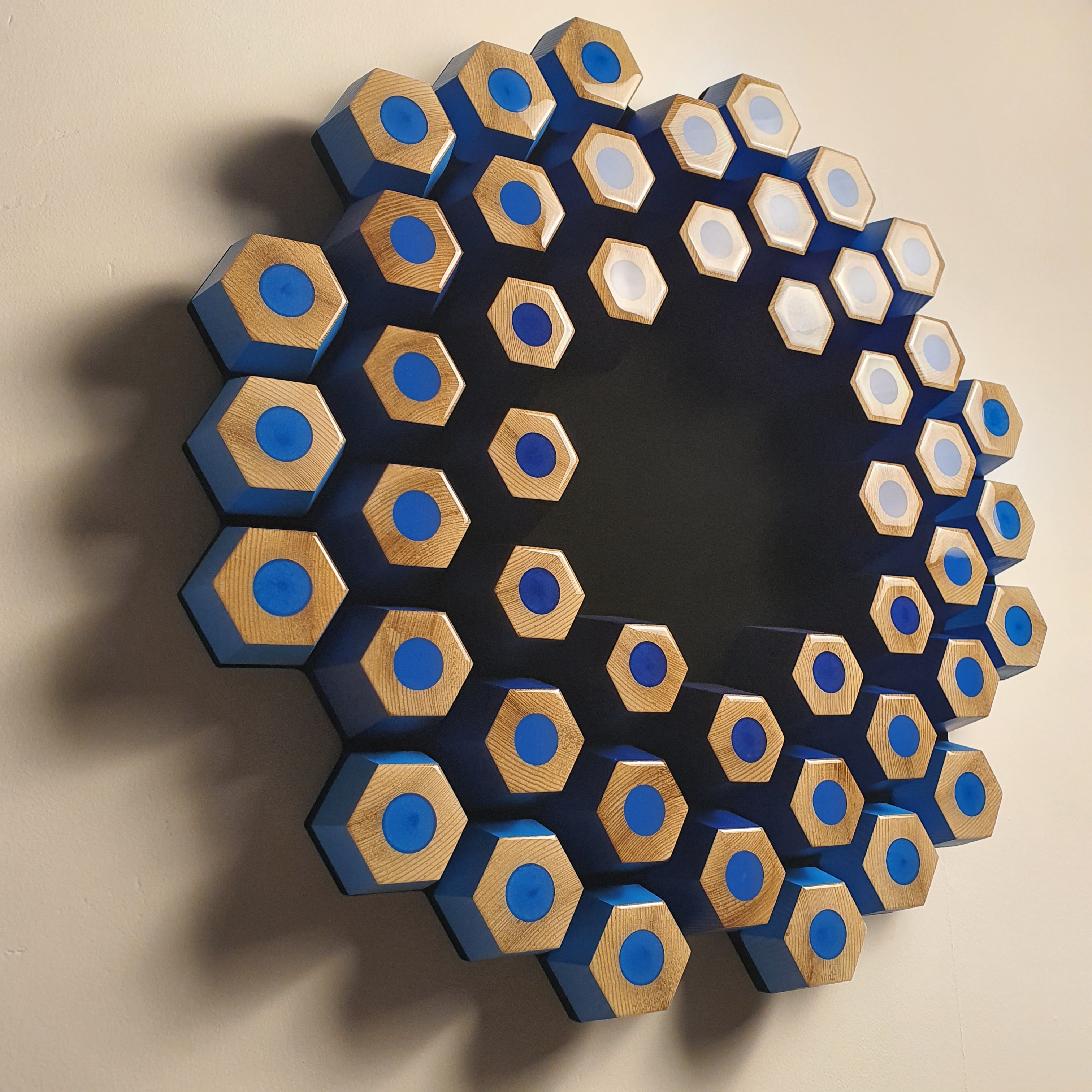 Abstract modular wall sculpture from the Profondità series with blue tones and spatial depth