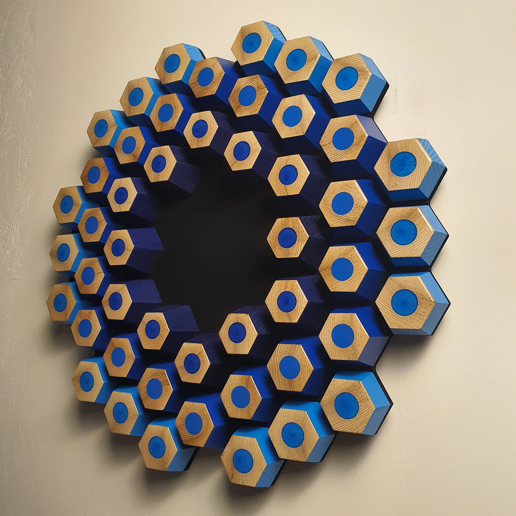Sculptural contemporary wall object with layered hexagons, epoxy resin and natural wood texture