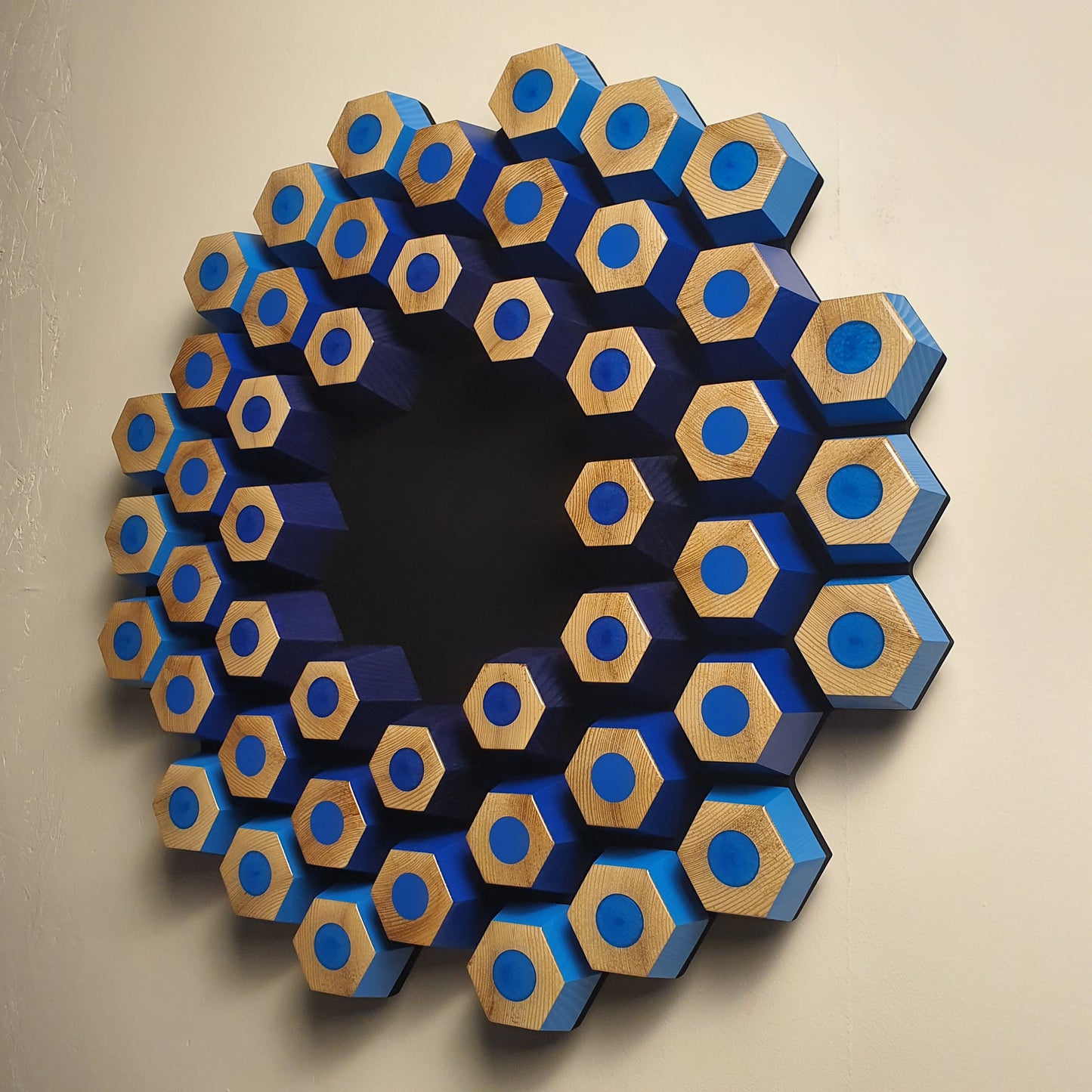 Sculptural contemporary wall object with layered hexagons, epoxy resin and natural wood texture