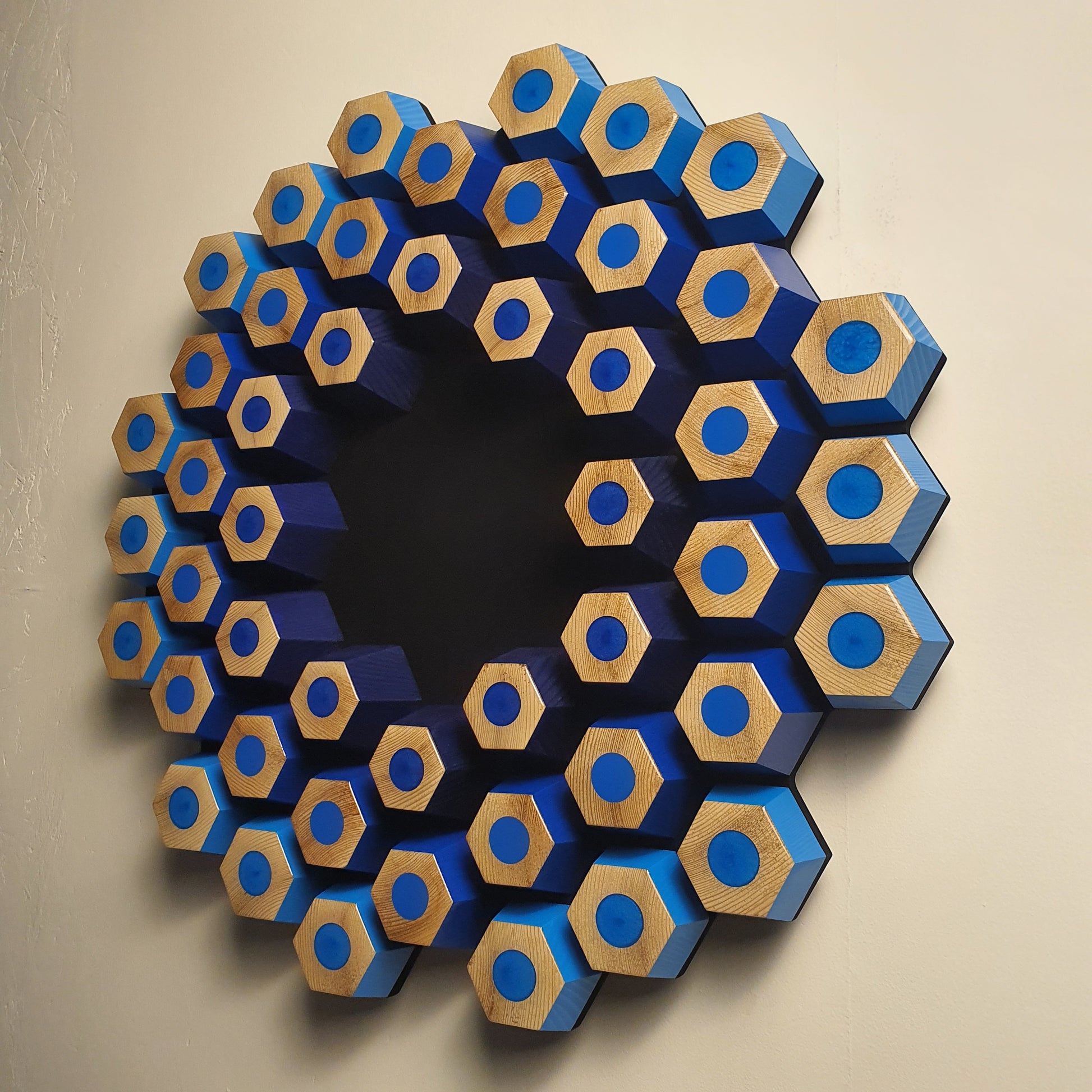 Sculptural contemporary wall object with layered hexagons, epoxy resin and natural wood texture