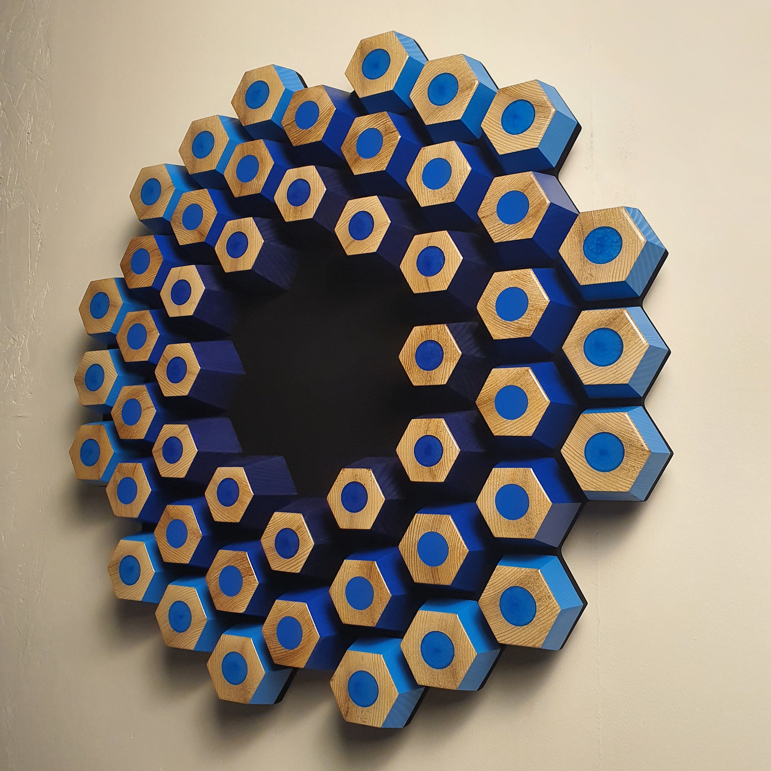 Sculptural contemporary wall object with layered hexagons, epoxy resin and natural wood texture