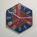 Prism of Time colorful pencil wall clock with white Roman numerals and chameleon background