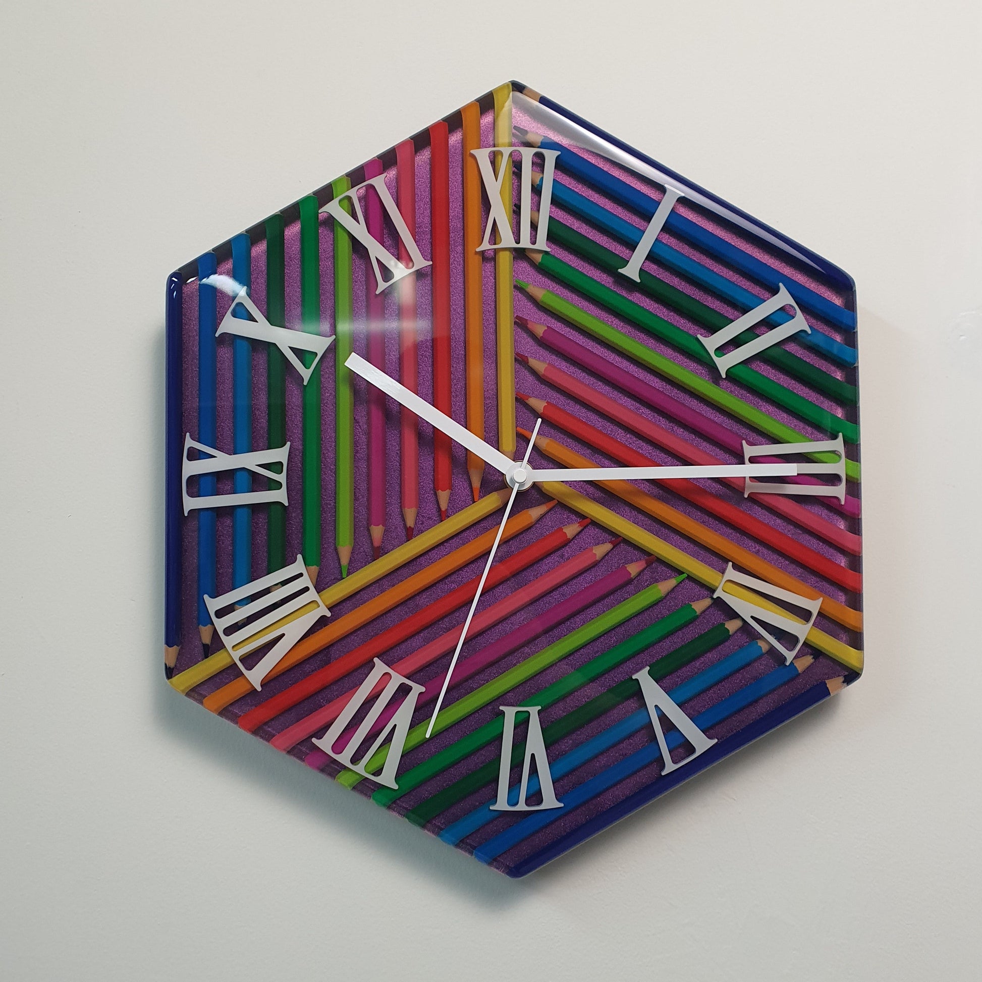 Prism of Time colorful pencil wall clock with white Roman numerals and chameleon background