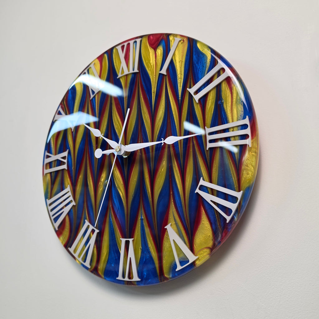 Contemporary wall clock with dynamic red, blue and yellow abstract design
