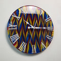 Abstract Time Primary Flow wall clock with red, yellow and blue resin pattern and white Roman numerals