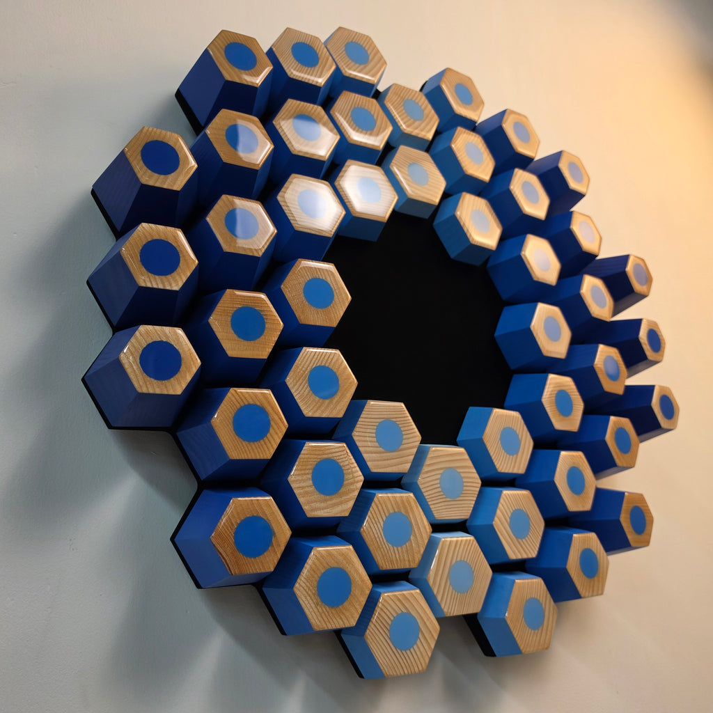 Contemporary sculptural relief crafted from wood, acrylic paint and epoxy resin