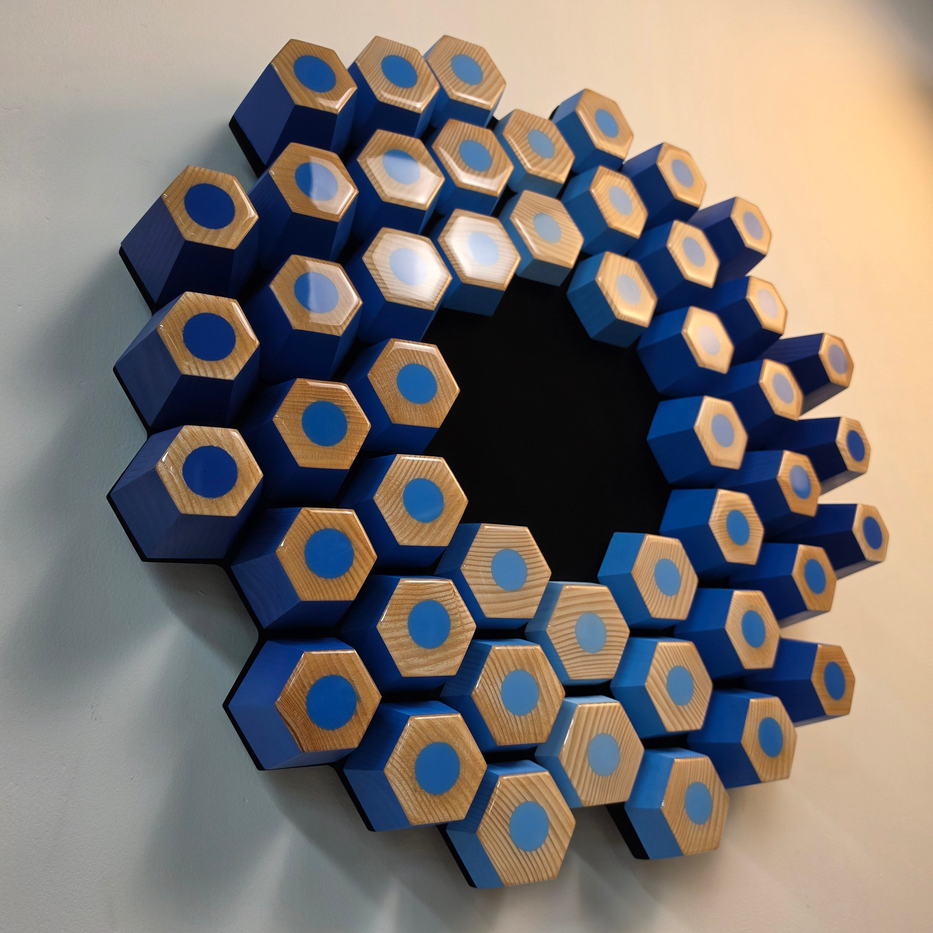 Contemporary sculptural relief crafted from wood, acrylic paint and epoxy resin