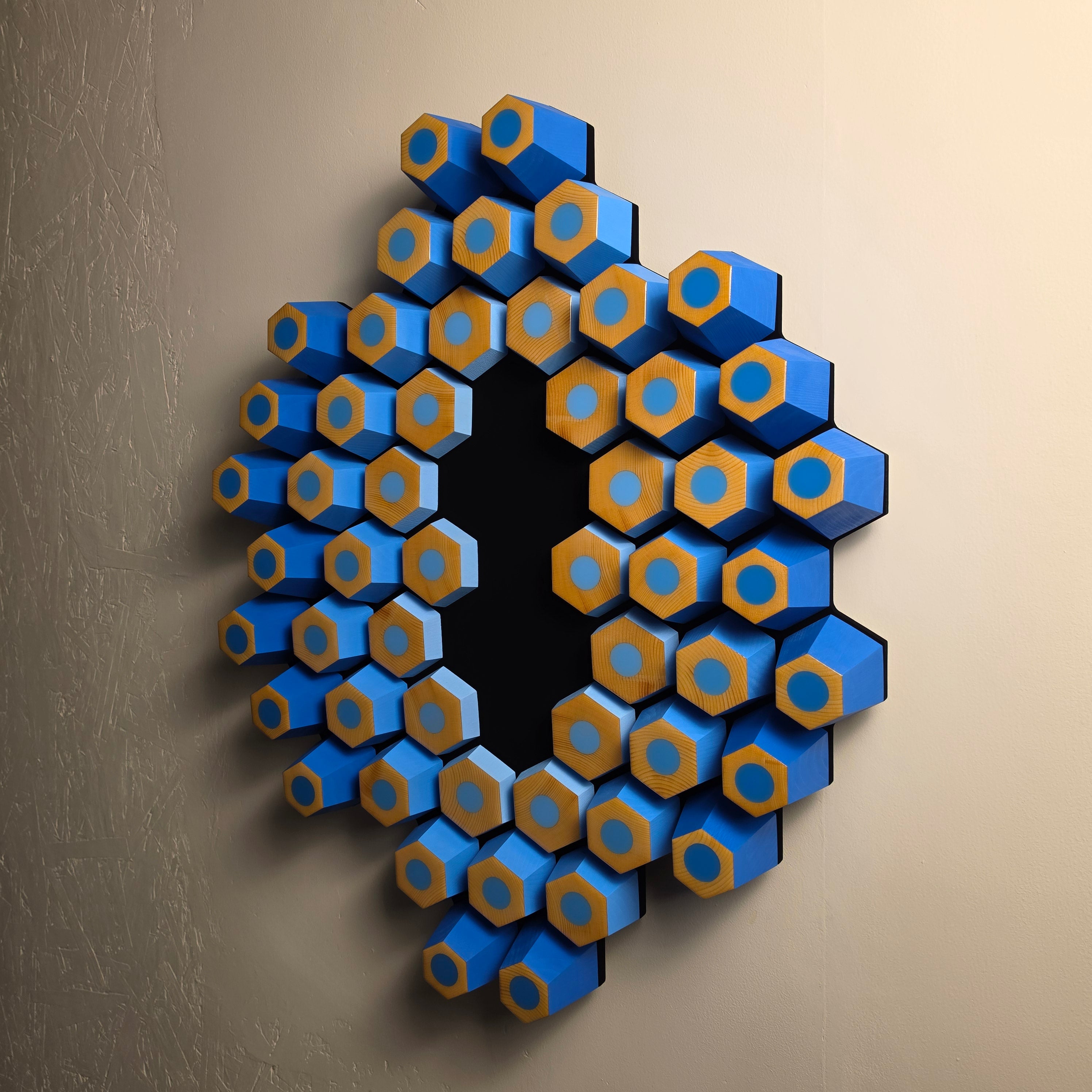 Contemporary geometric wall artwork with angled wooden hexagons, glossy resin tops and ultra matte black background