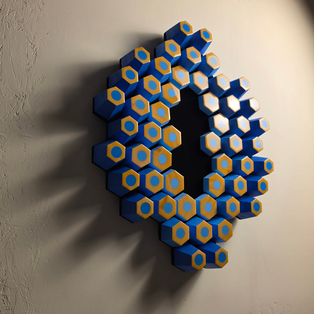 Contemporary collectible artwork combining natural wood, epoxy resin and a deep black light-absorbing surface