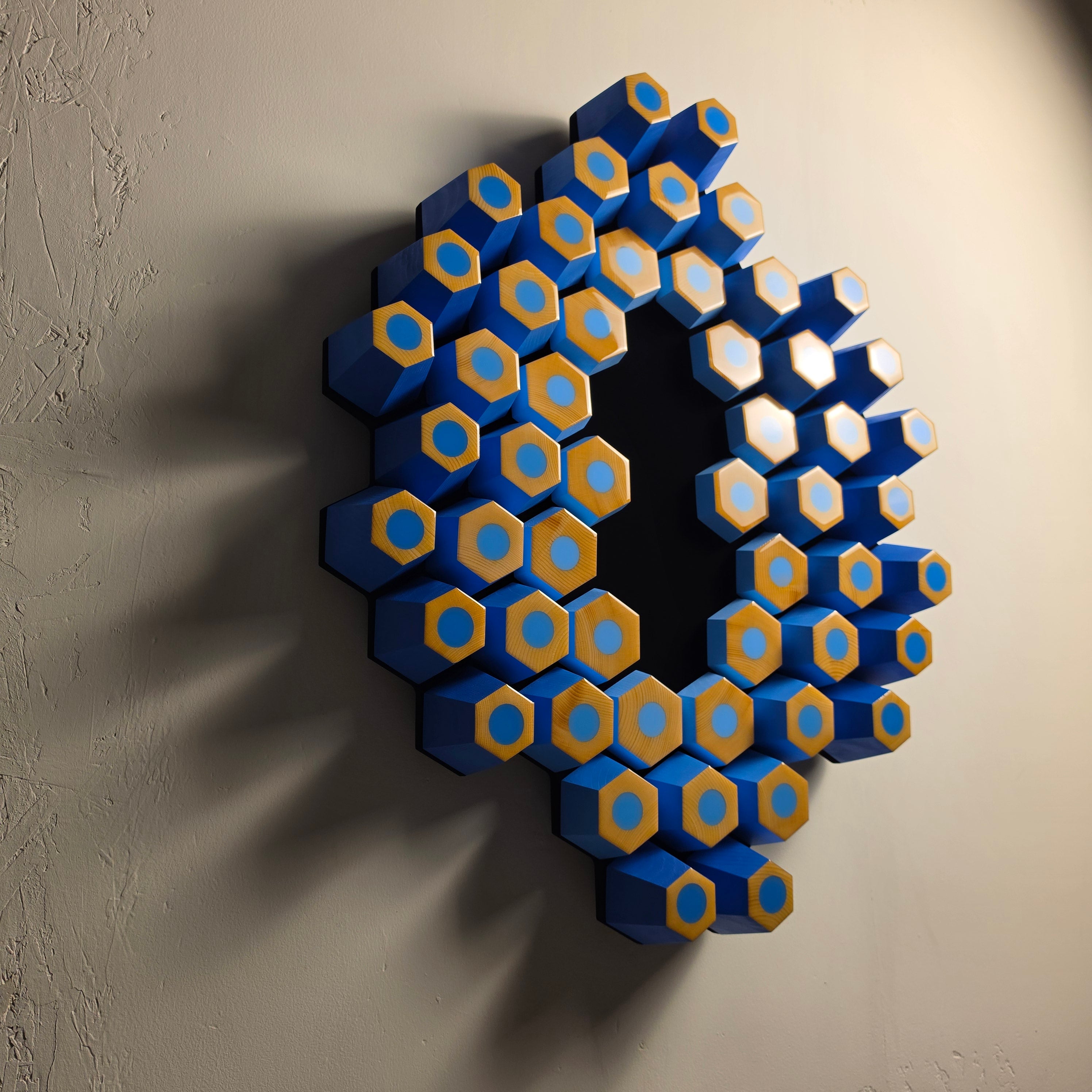 Contemporary collectible artwork combining natural wood, epoxy resin and a deep black light-absorbing surface