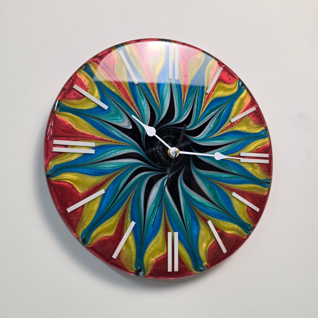 Contemporary wall clock with swirling metallic pigments and minimalist white markers