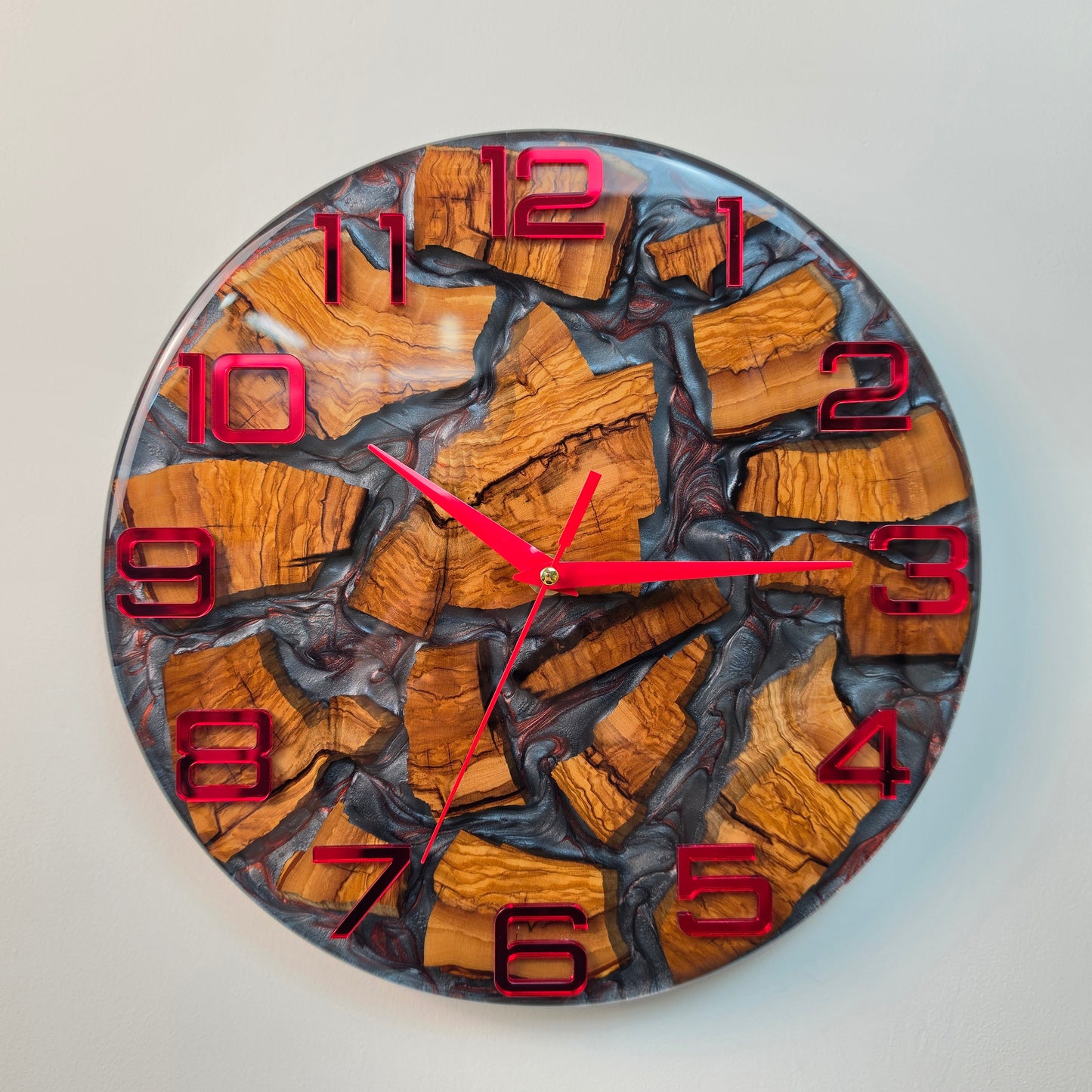 Red Veins of Time wall clock made from olive wood and gray epoxy resin