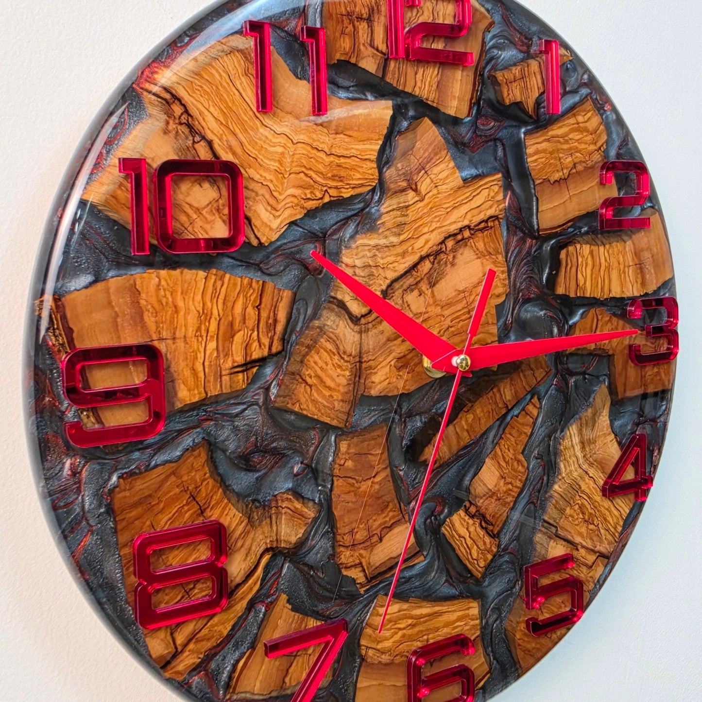 Handcrafted olive wood wall clock with red mirrored plexiglass numerals