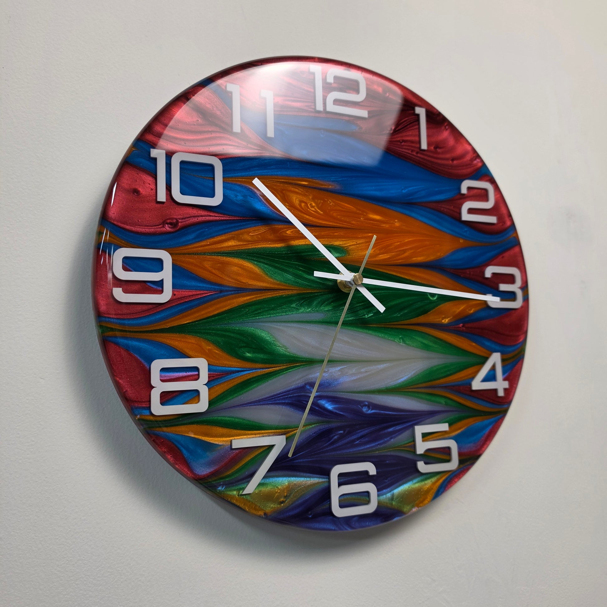 Color Current epoxy resin wall clock with flowing multicolor pattern and white plexiglass numbers