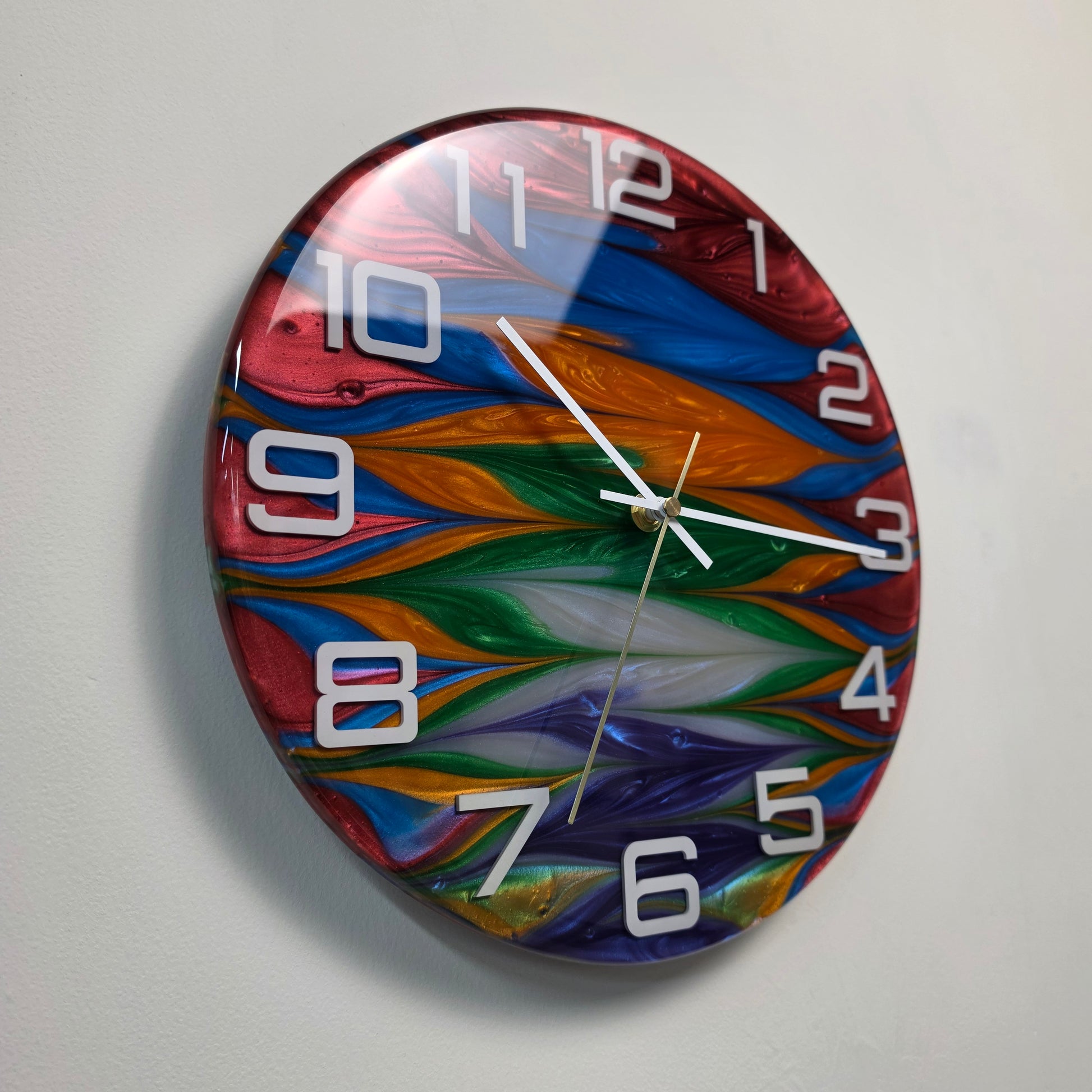 Unique epoxy resin clock with vibrant flowing colors and white raised markers