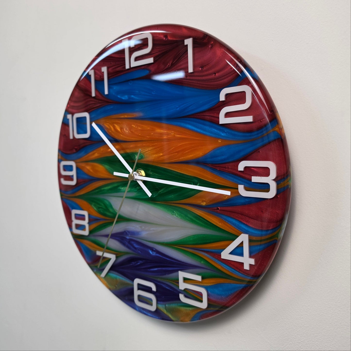Modern artistic wall clock with colorful wave design embedded in clear epoxy resin