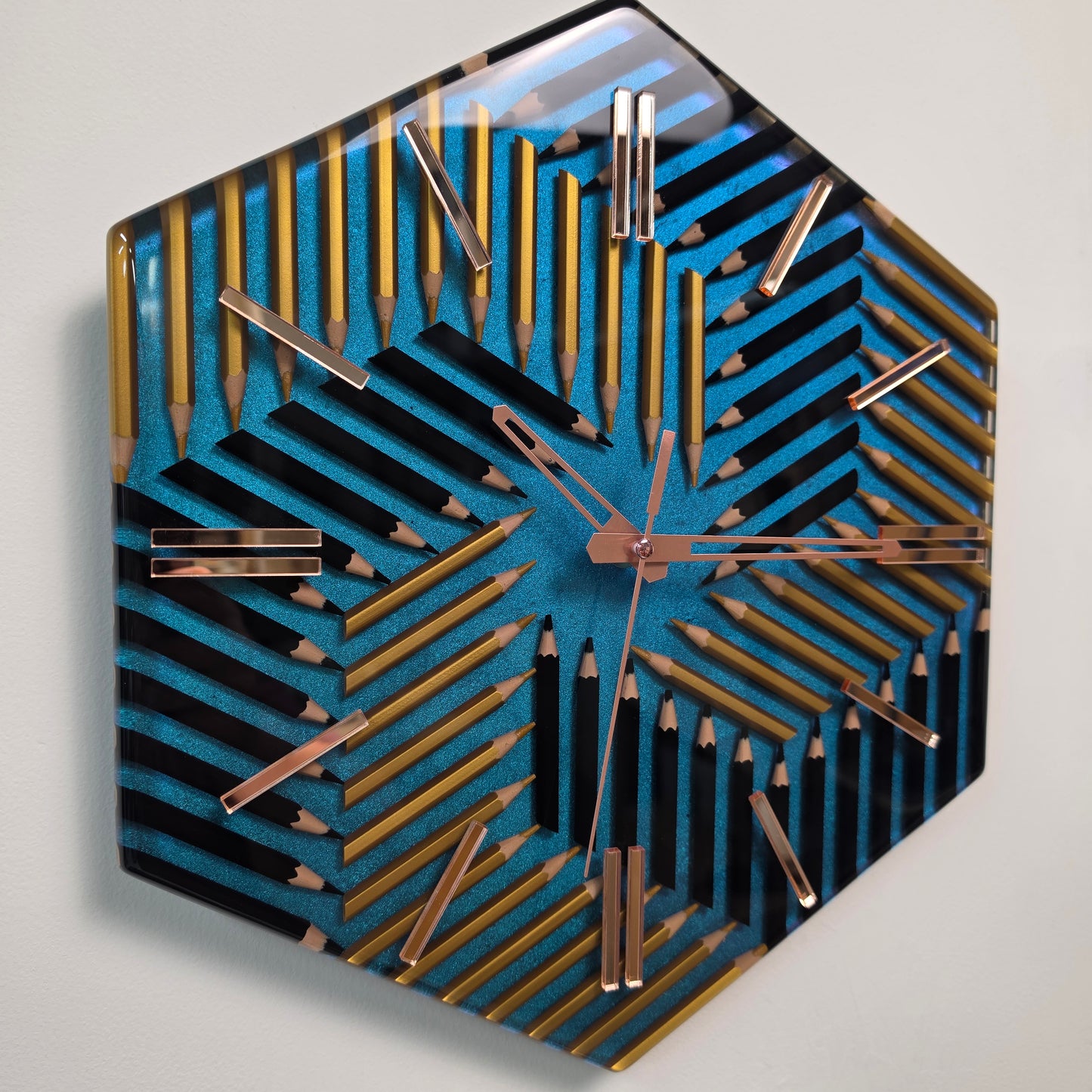 Handmade geometric pencil clock with metallic blue chameleon finish