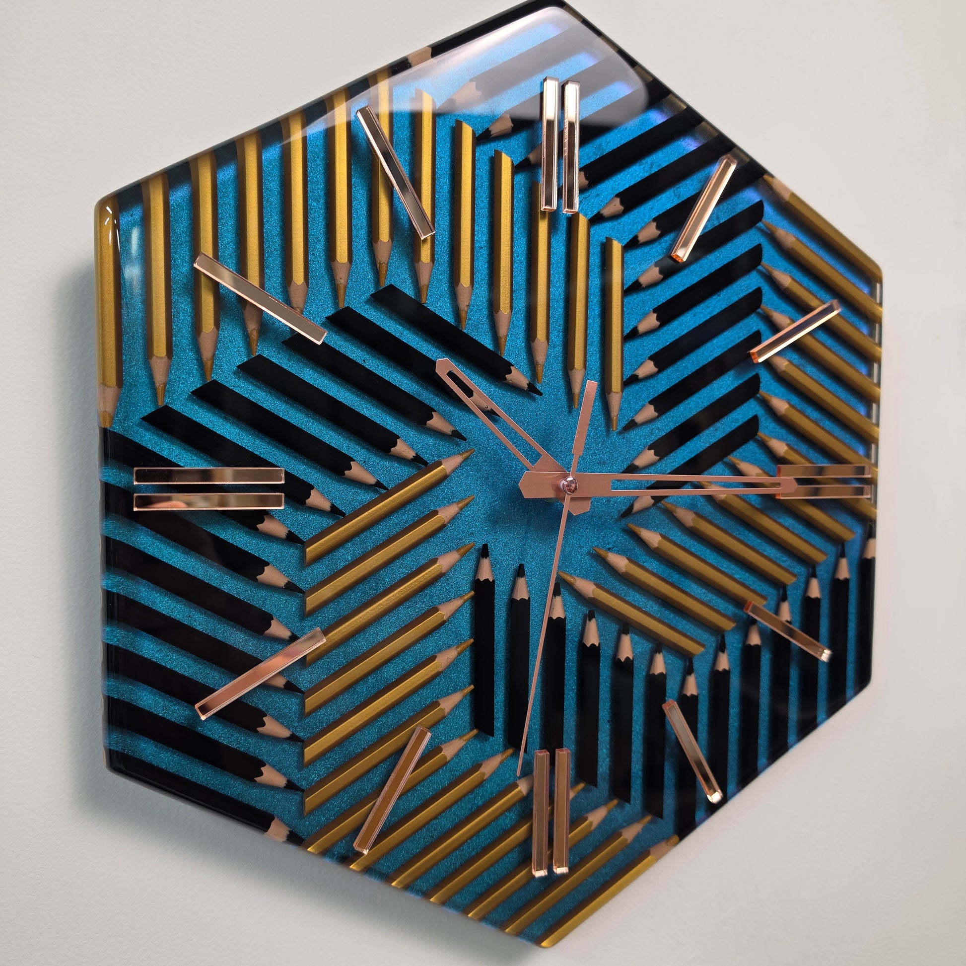 Handmade geometric pencil clock with metallic blue chameleon finish