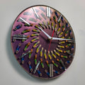 Drawn Into Color wall clock with colored pencils arranged in a spiral pattern
