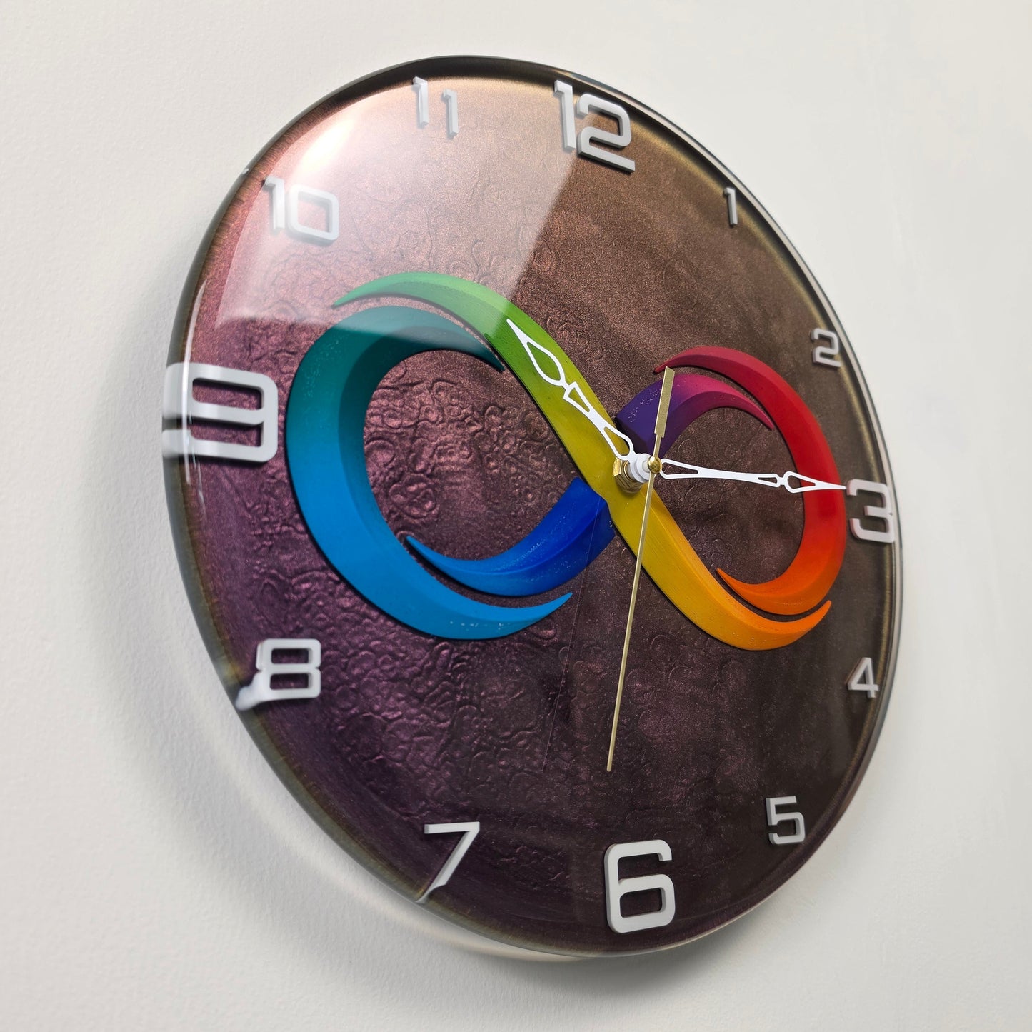 Unique resin clock with colorful infinity design, glossy finish and white plexiglass markers