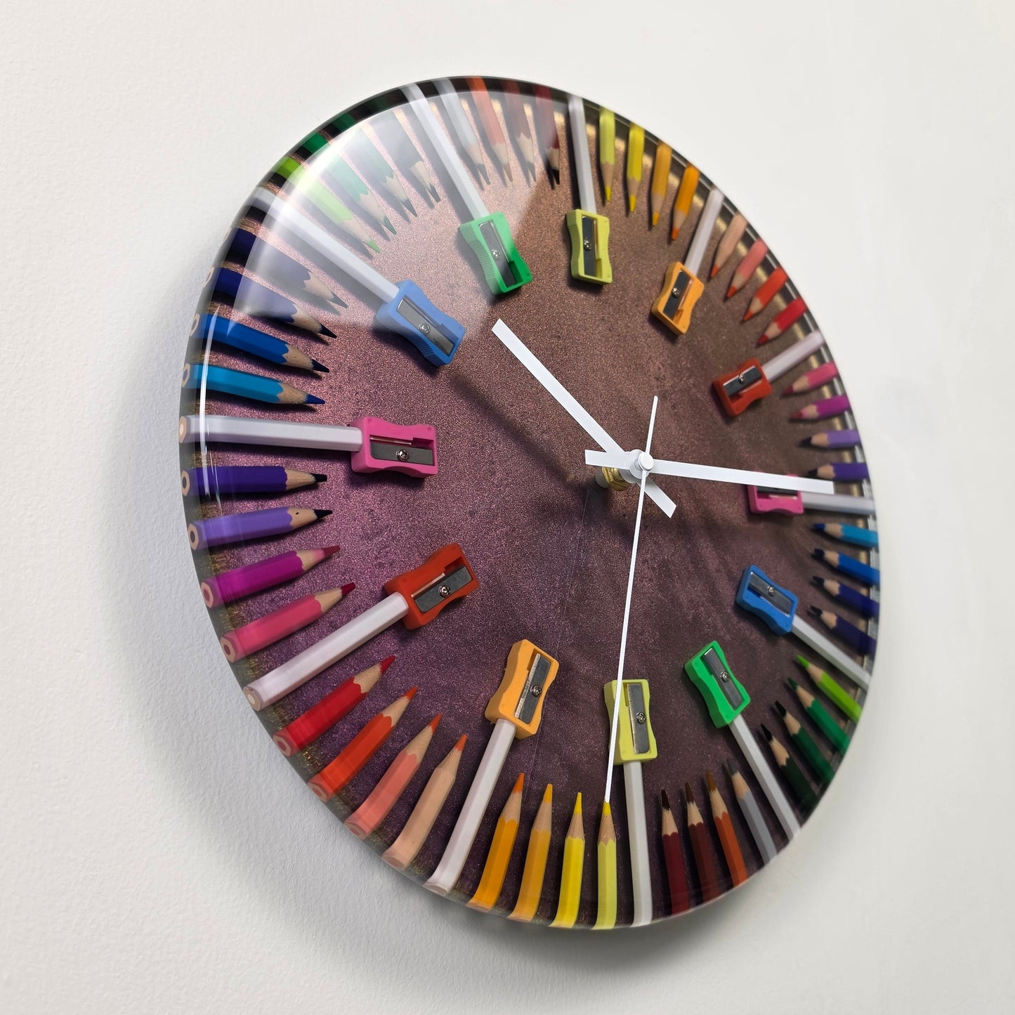 Close-up of colored pencils and pencil shavings embedded in glossy epoxy resin