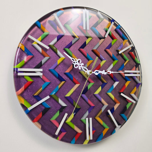 Kaleido Path handmade wall clock with colorful pencil fragments arranged in a geometric zigzag pattern and clear epoxy resin.