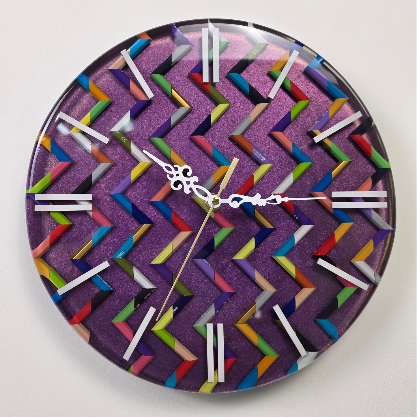 One-of-a-kind functional wall art with colorful pencil fragments, hypnotic zigzag design and handcrafted epoxy resin finish.
