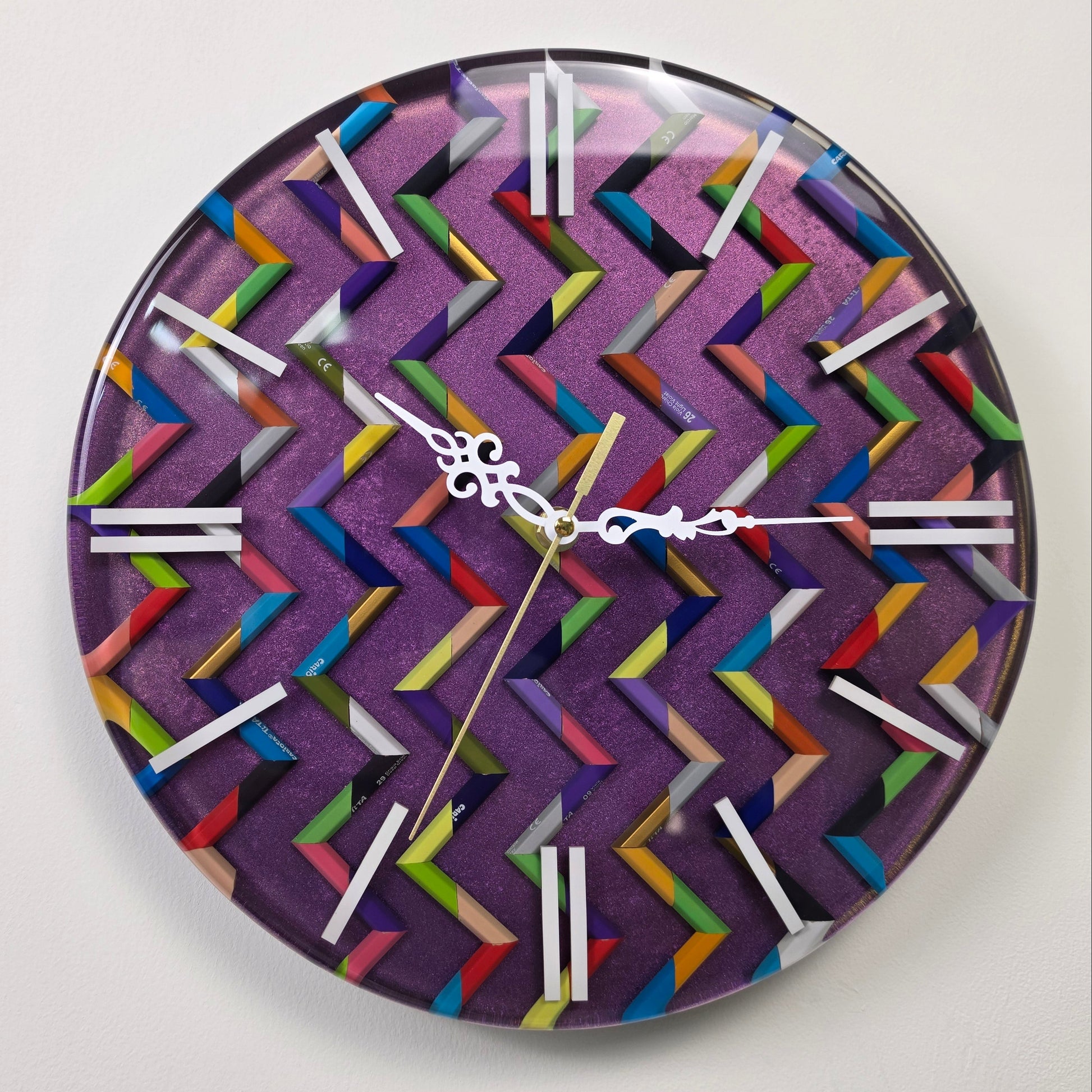 One-of-a-kind functional wall art with colorful pencil fragments, hypnotic zigzag design and handcrafted epoxy resin finish.