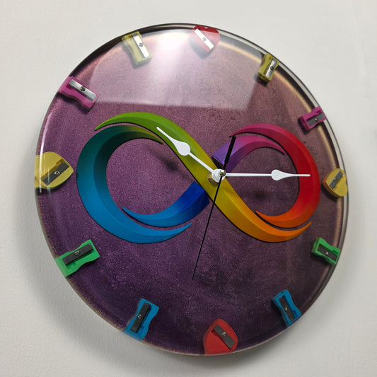 Timeless Symbols Infinite Creativity handmade wall clock with colorful infinity symbol and heart-shaped pencil sharpeners