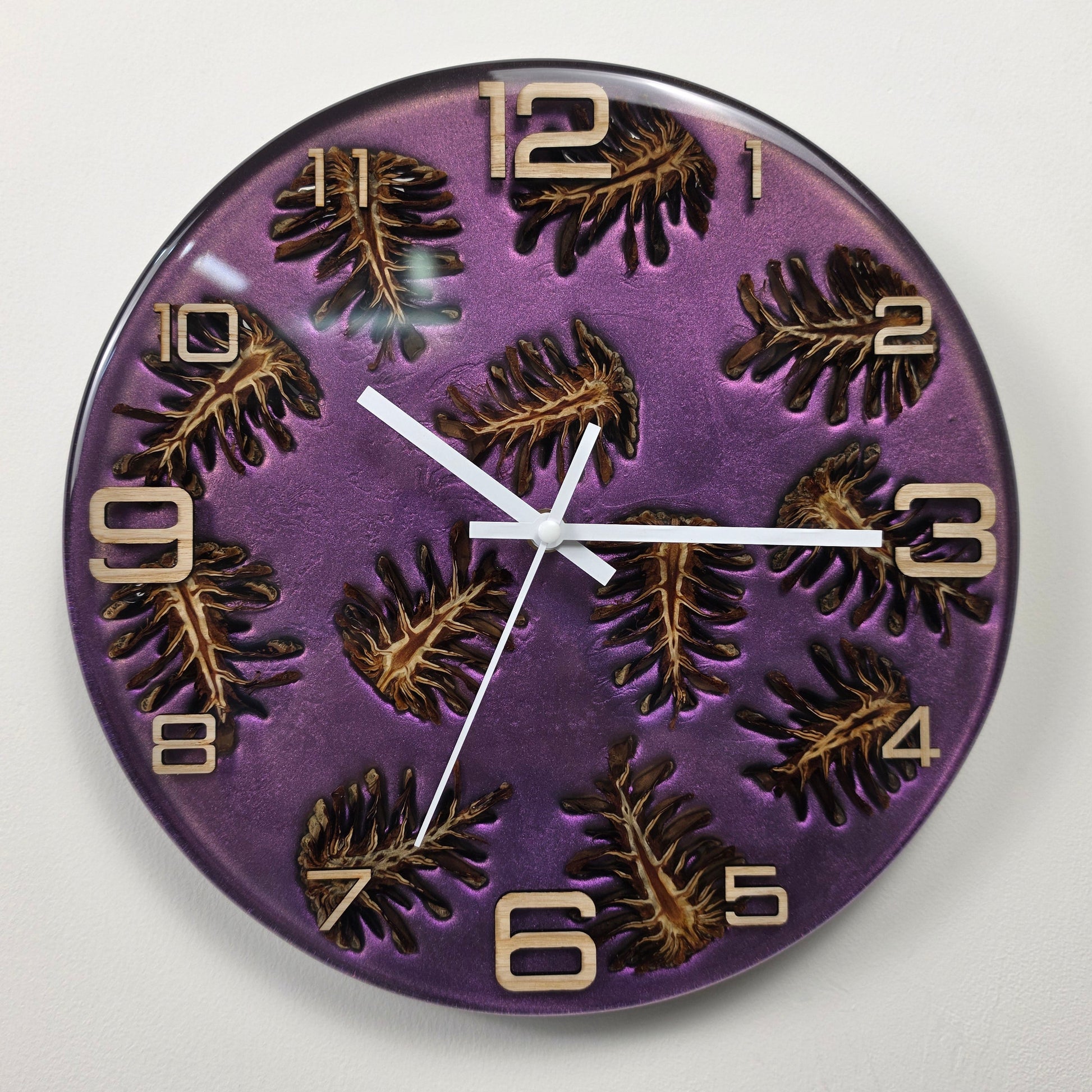 Luxury handmade wall clock with pine cones, metallic epoxy resin background and ash wood numerals