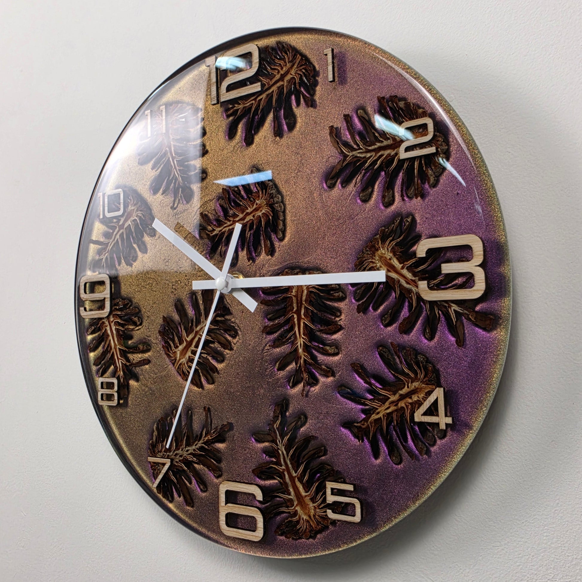 Nature-inspired wall clock featuring natural pine cones, ash wood numerals and functional art design